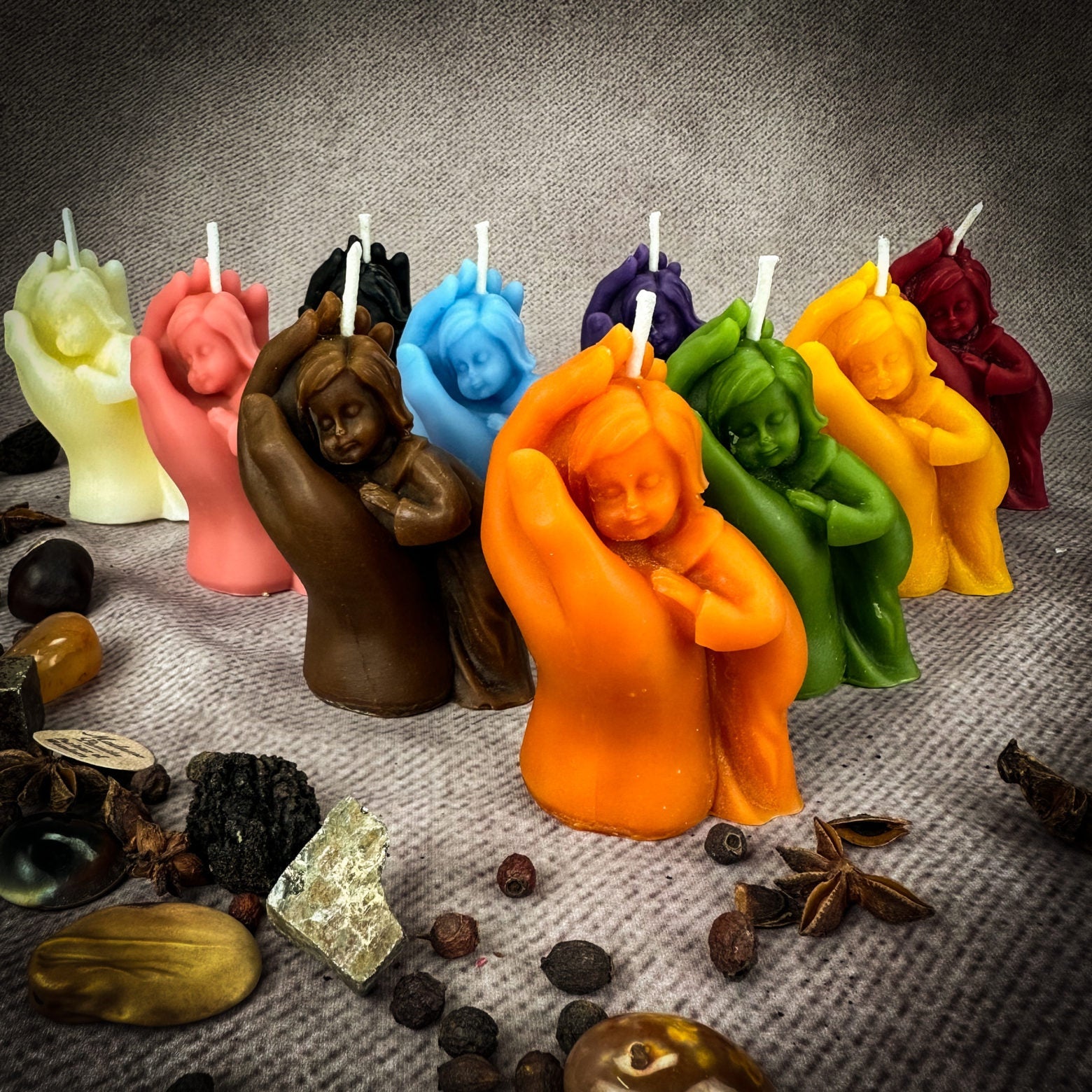 Yellow beeswax candle featuring a mother and child design, symbolizing protection, fertility, and family blessings.