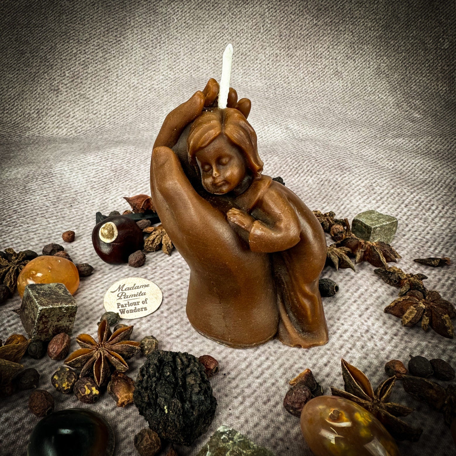 Yellow beeswax mother and child spell candle by Parlour of Wonders, featuring intricate designs for protection, fertility, and family blessings.