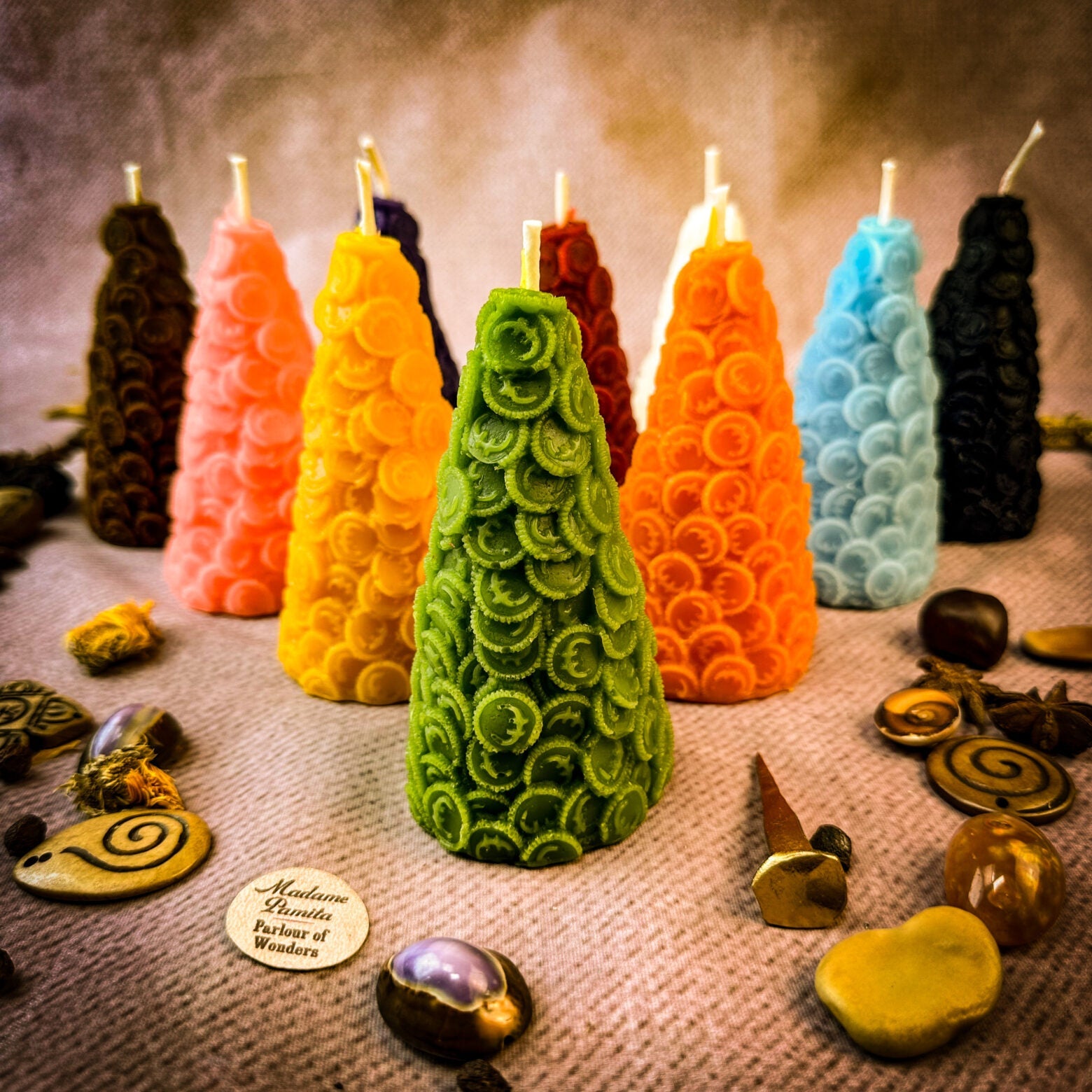 Yellow beeswax cone of coins spell candle by Parlour of Wonders, designed for money magnet and prosperity magic.