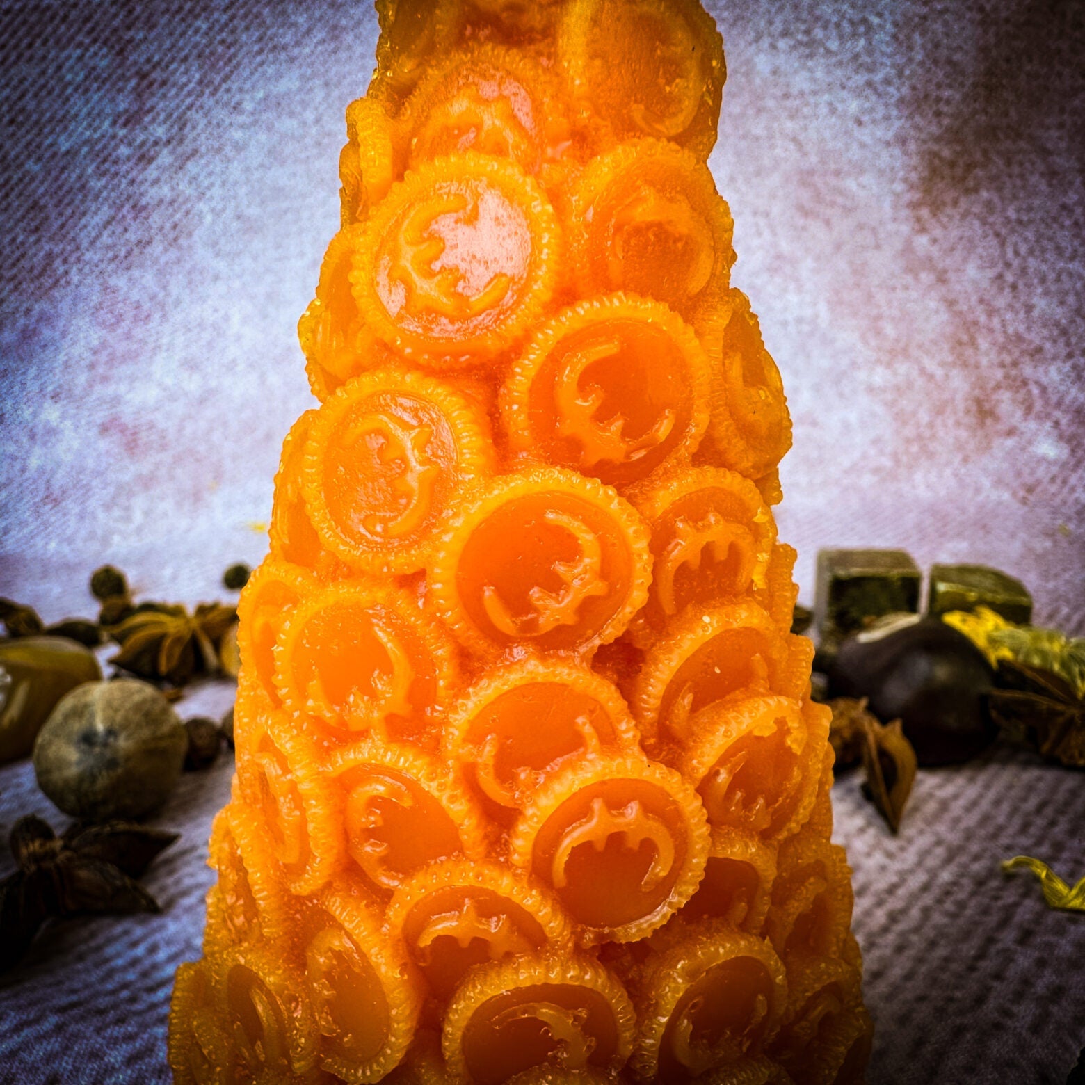 Yellow beeswax cone of coins spell candle by Parlour of Wonders, designed for money magnet and prosperity magic.