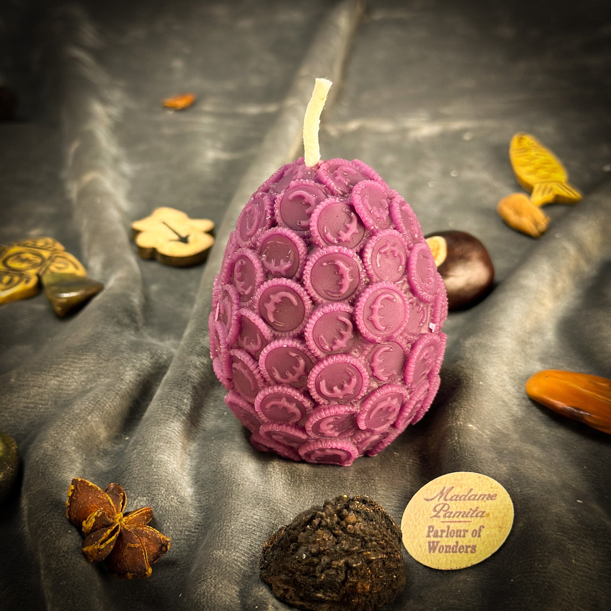 Yellow beeswax nest egg spell candle by Parlour of Wonders symbolizing savings and financial security.
