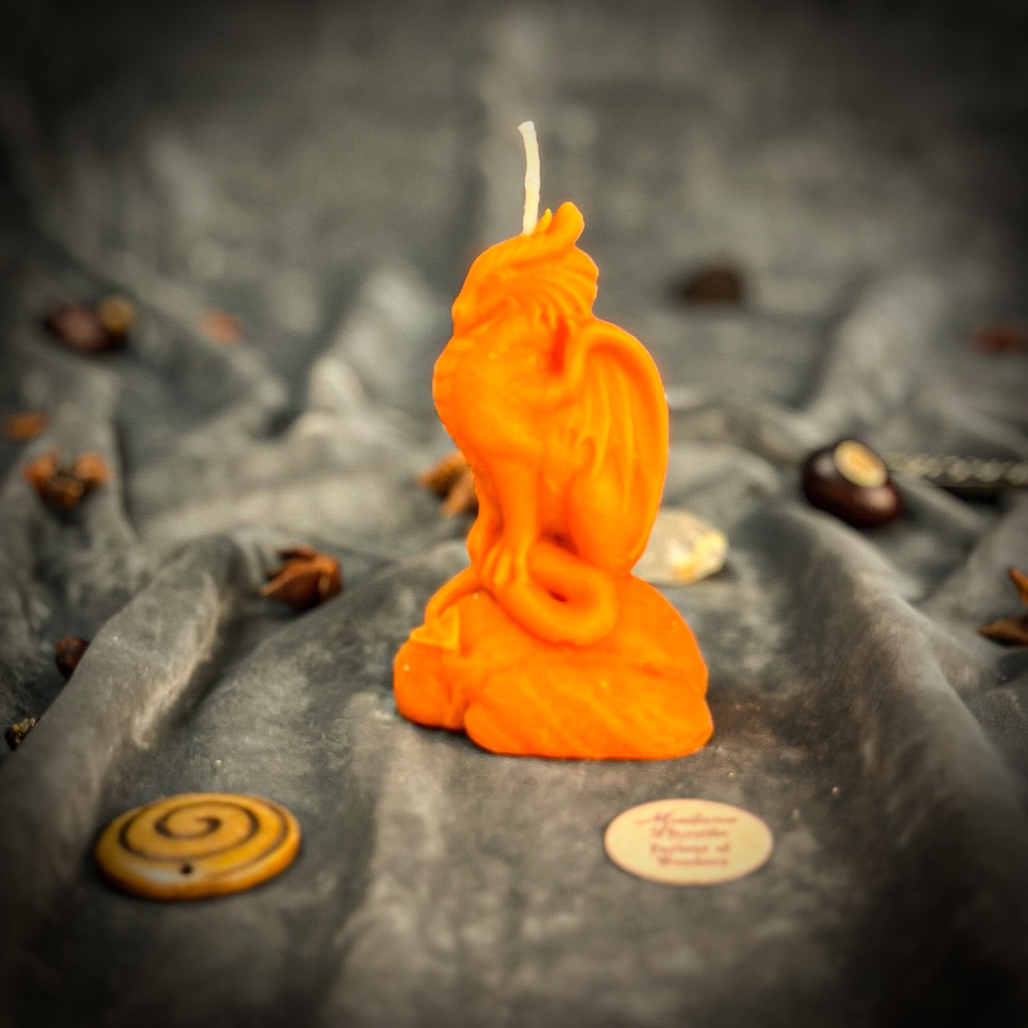 Yellow beeswax candle featuring a carved dragon design, symbolizing protection, guardian magic, and power for spiritual defense.