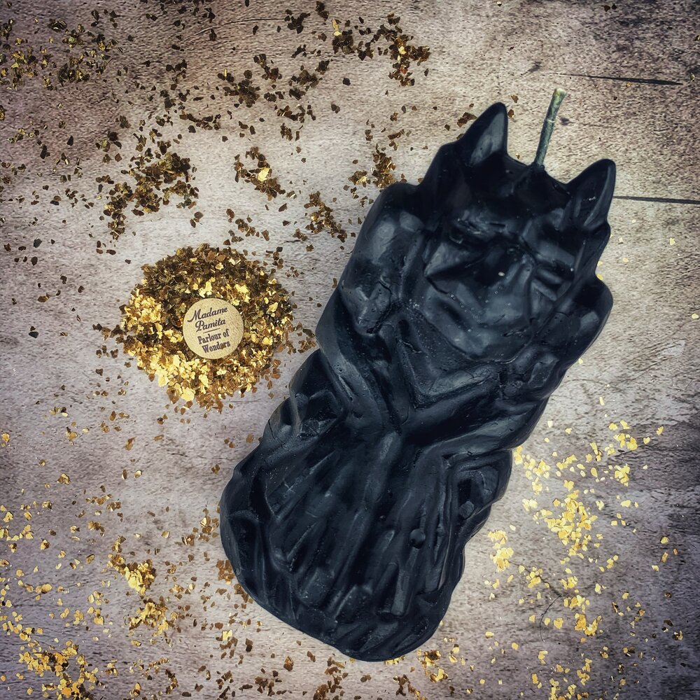 Yellow beeswax candle with a gargoyle protector design by Parlour of Wonders, used for guardian and protection magic.