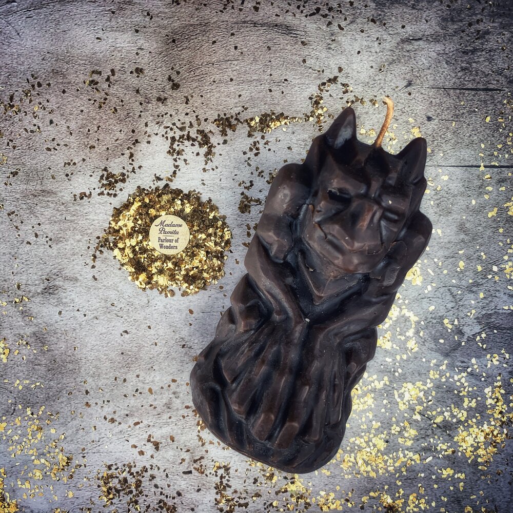 Yellow beeswax candle featuring a gargoyle protector for guardian and protection magic, by Parlour of Wonders.
