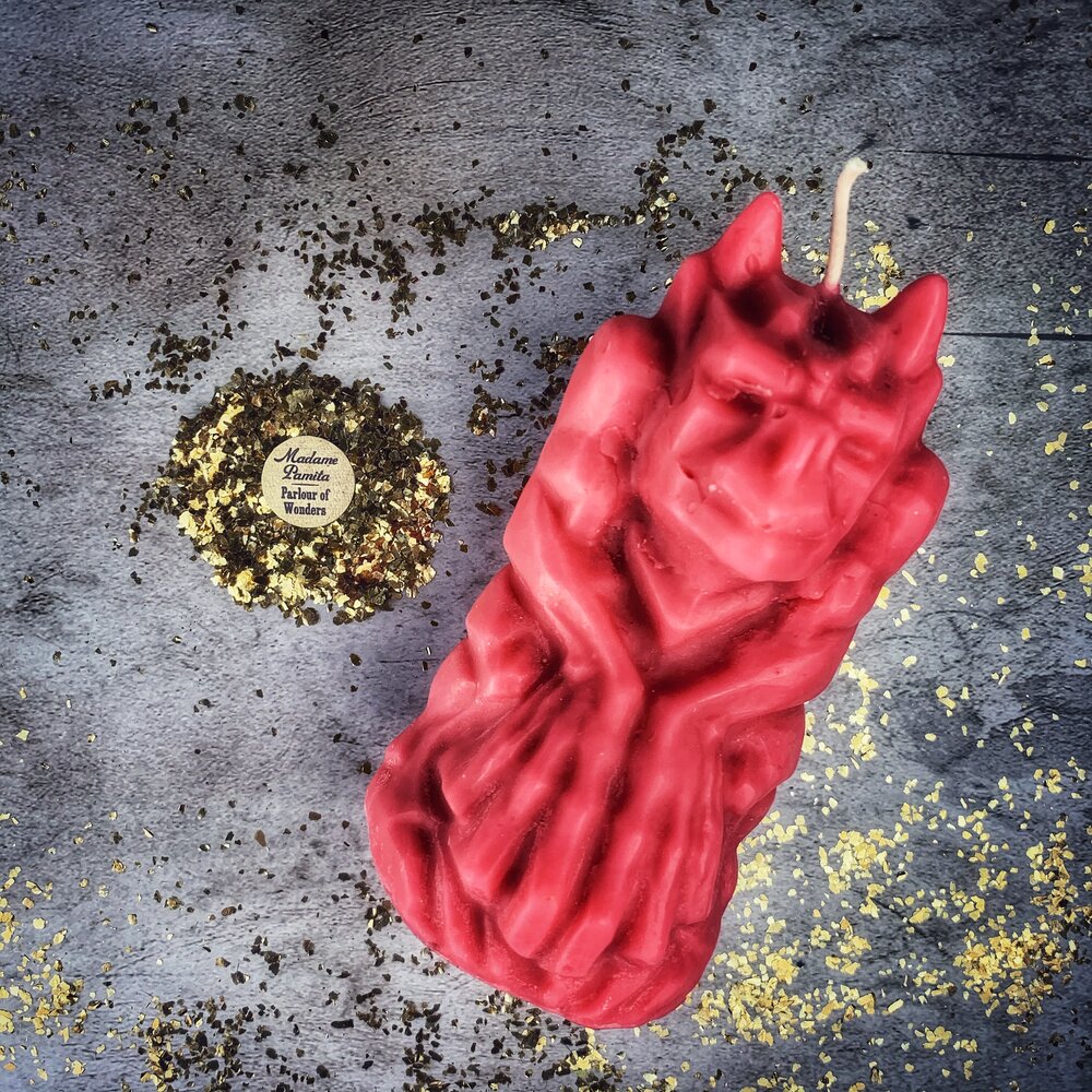Yellow beeswax candle with a gargoyle protector design, used for guardian and protection magic by Parlour of Wonders.