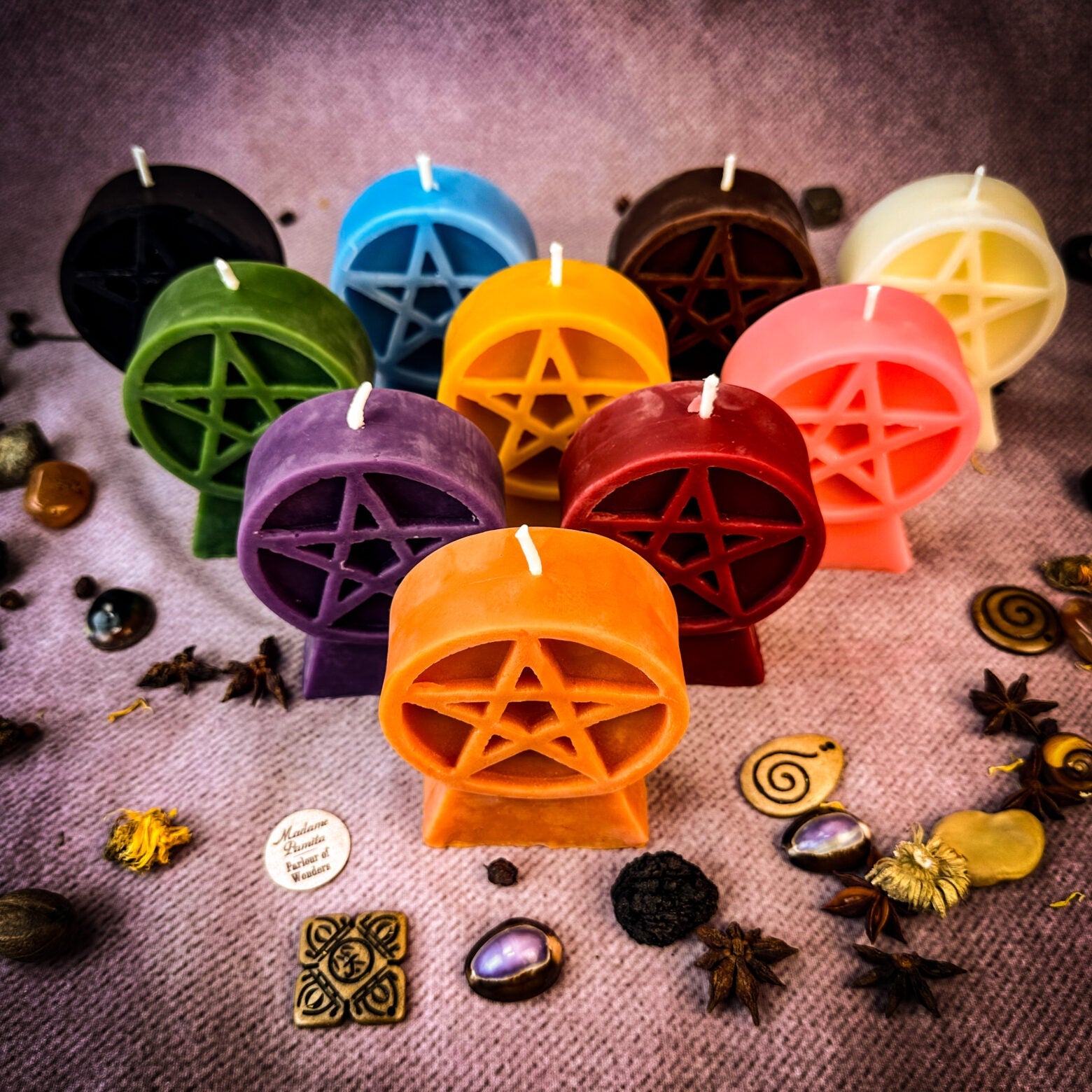 Yellow beeswax candle with pentacle of protection symbol, representing five elements and spiritual safety.