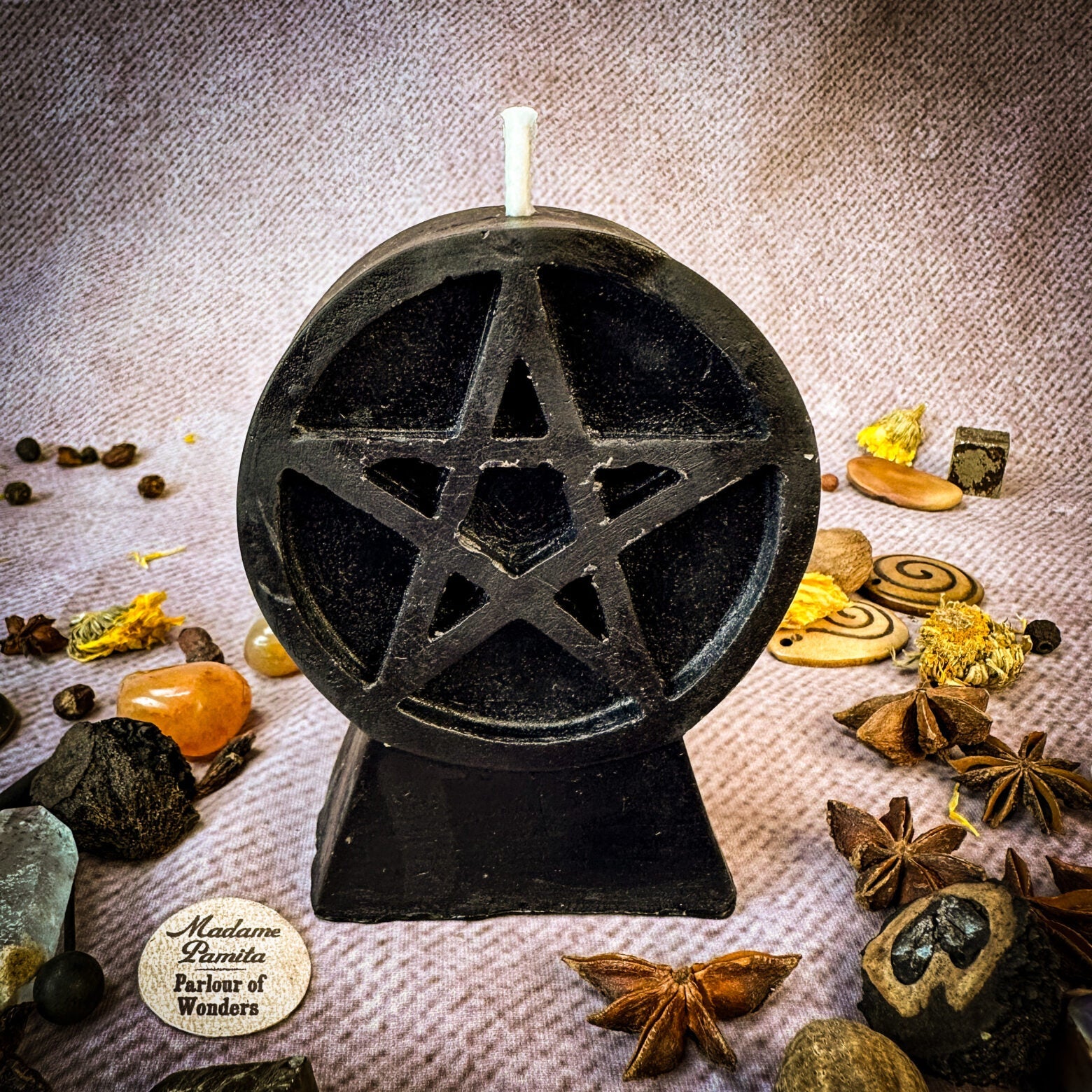 Yellow beeswax candle with pentacle design, symbolizing protection and spiritual safety, from Parlour of Wonders.