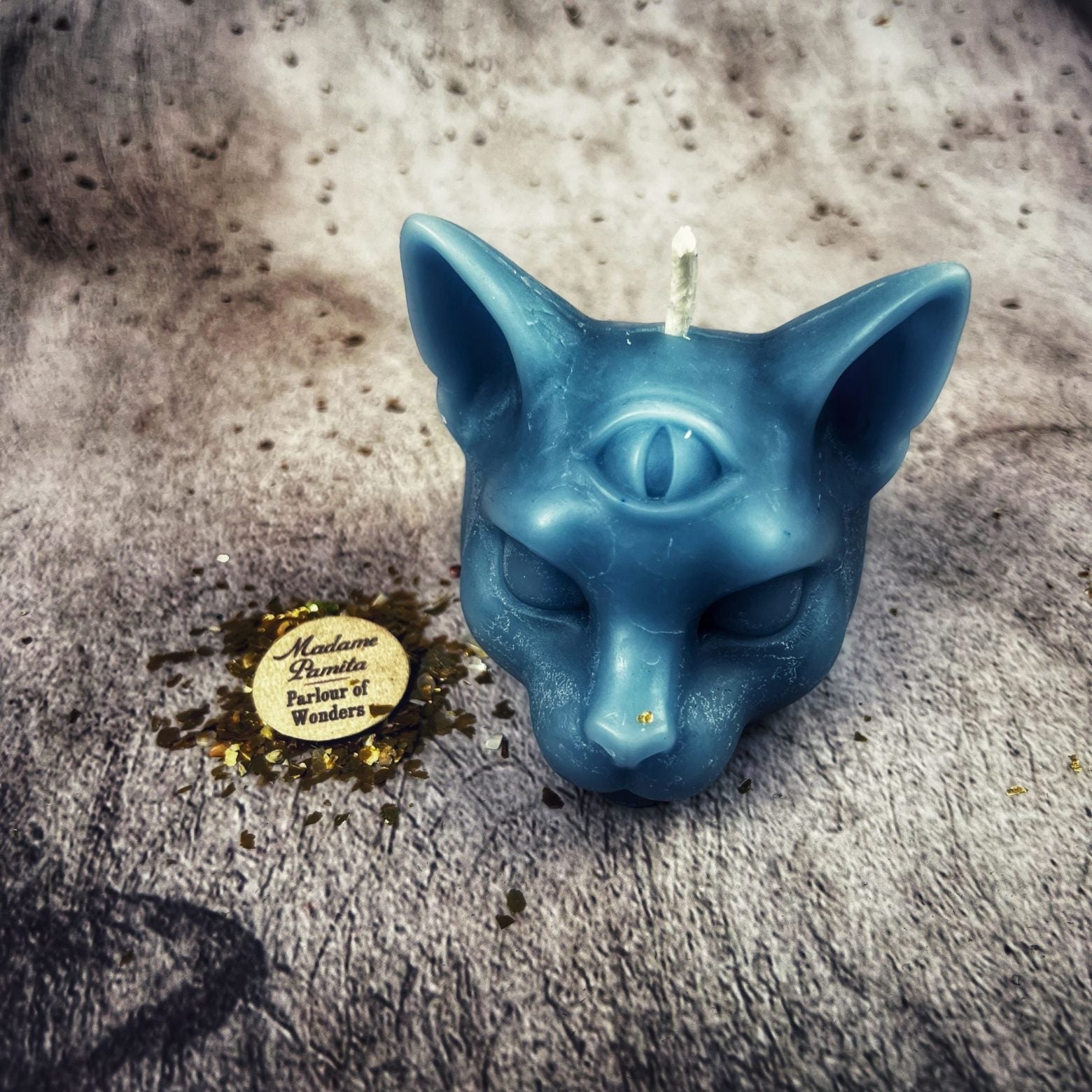Yellow beeswax psychic cat spell candle by Parlour of Wonders for intuition, clairvoyance, and magic, featuring a feline design.