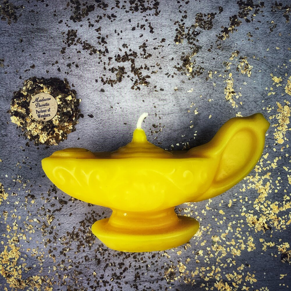 Yellow beeswax Aladdin's lamp spell candle by Parlour of Wonders, featuring intricate design for wish manifestation and magic.