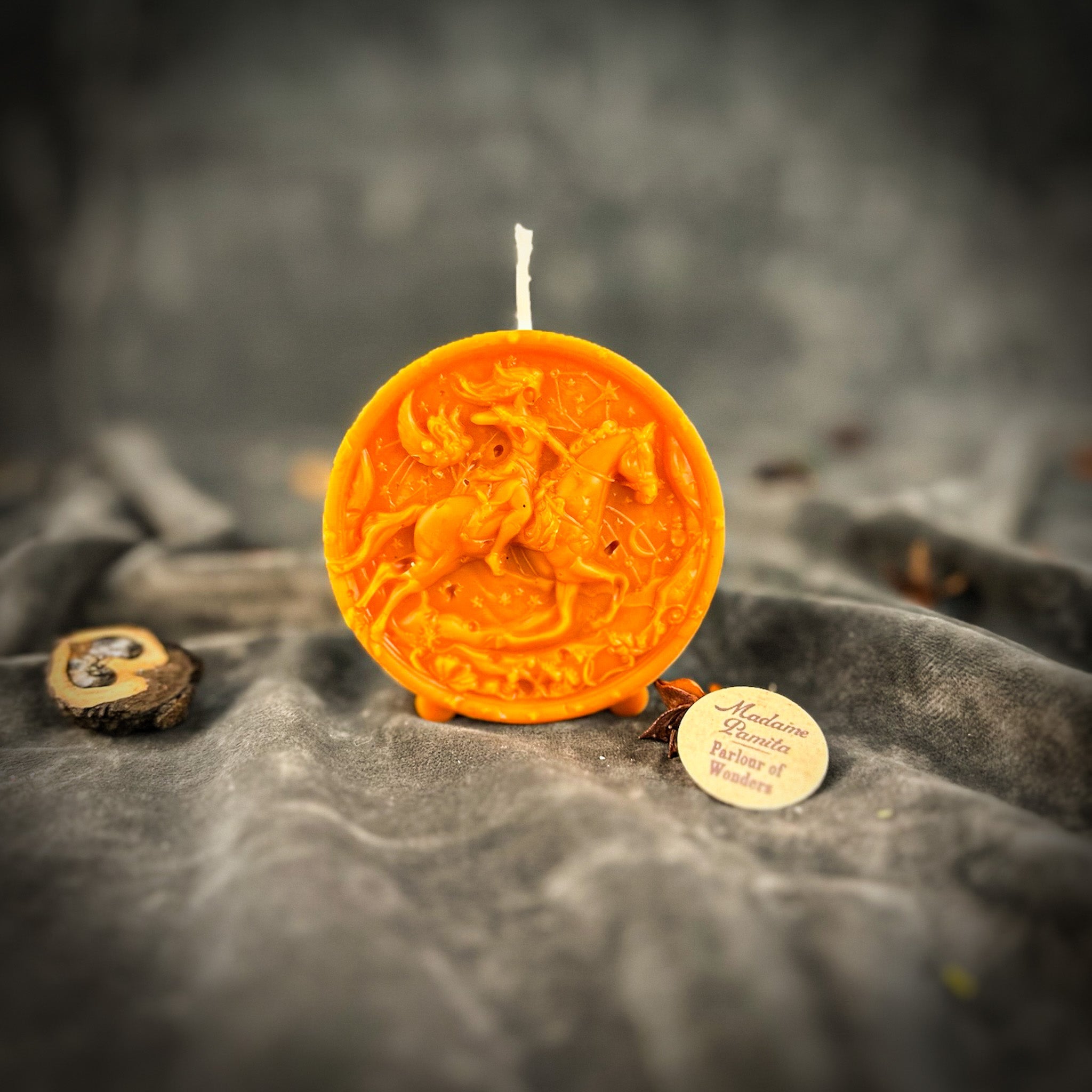 Yellow beeswax Sagittarius Archer zodiac spell candle by Parlour of Wonders, featuring intricate design symbolizing adventure and wisdom.