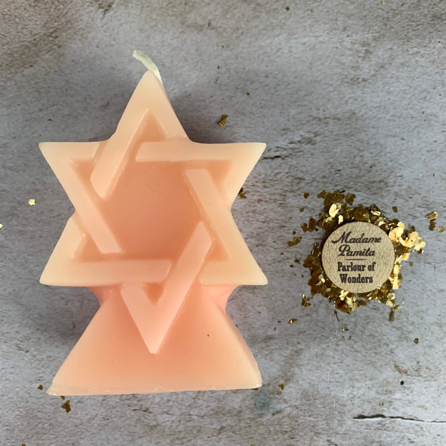Yellow beeswax seal of Solomon spell candle by Parlour of Wonders, featuring intricate divine protection symbols and a natural wax finish.