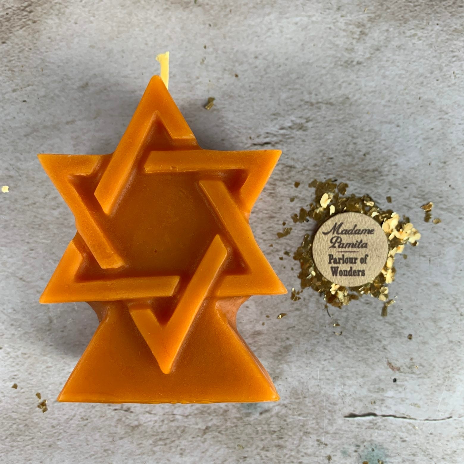 Yellow beeswax candle with Solomon Seal design from Parlour of Wonders, symbolizing protection and divine power.