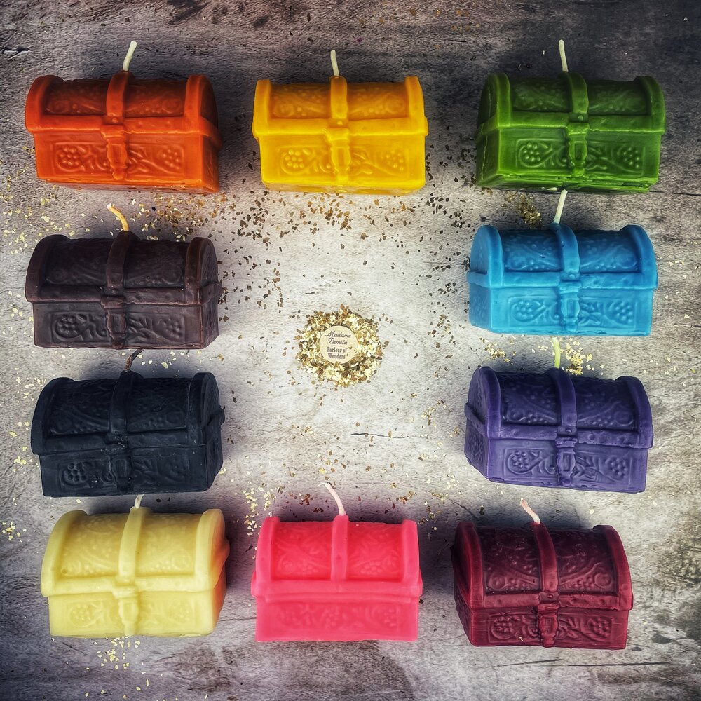 Yellow beeswax candle shaped like a treasure chest from Parlour of Wonders, used for blessings and abundance magic.