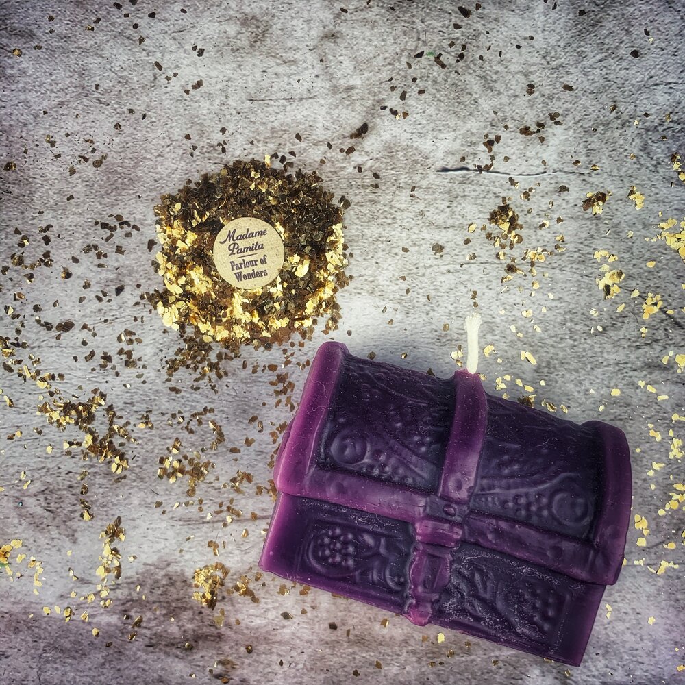 Yellow beeswax candle shaped like a treasure chest by Parlour of Wonders, used for blessings and abundance magic.