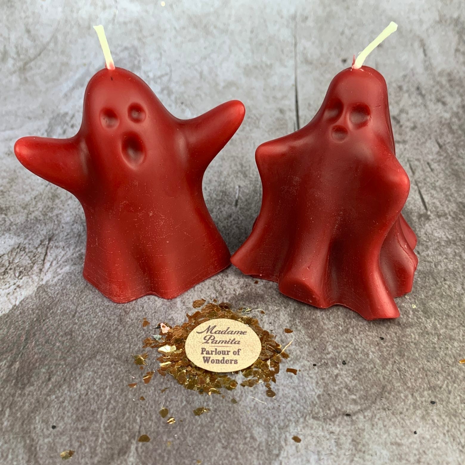 Set of yellow beeswax candles featuring ghost-shaped designs for wishing, spirit guide, and ancestor magic rituals.