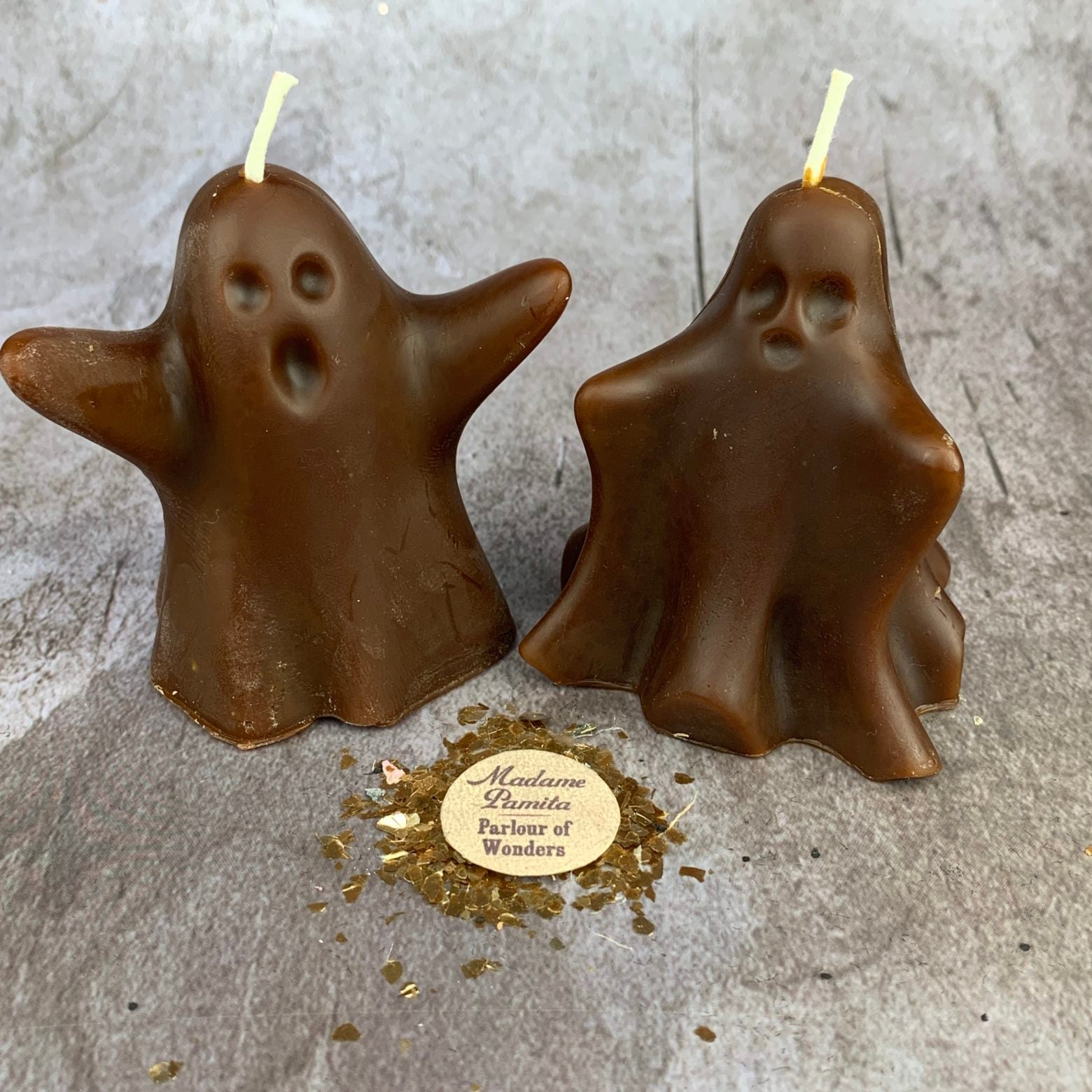 Beeswax Wishing Ghosts Spell Candle Set by Parlour of Wonders featuring yellow beeswax candles with ghost-shaped designs for spirit magic.