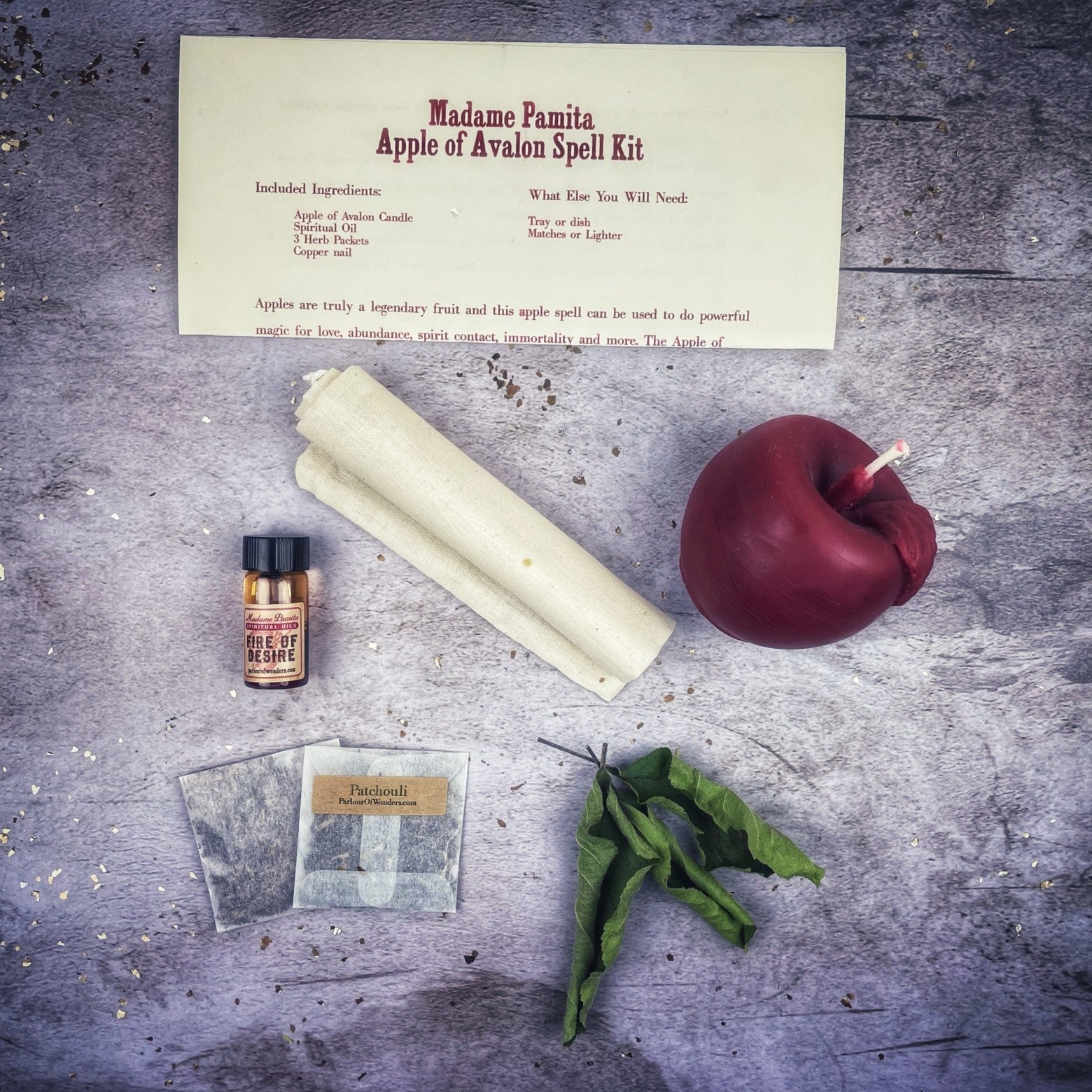 Apple of Avalon Candle Spell Kit by Parlour of Wonders with black candles and magical symbols for love, abundance, and ancient magic.