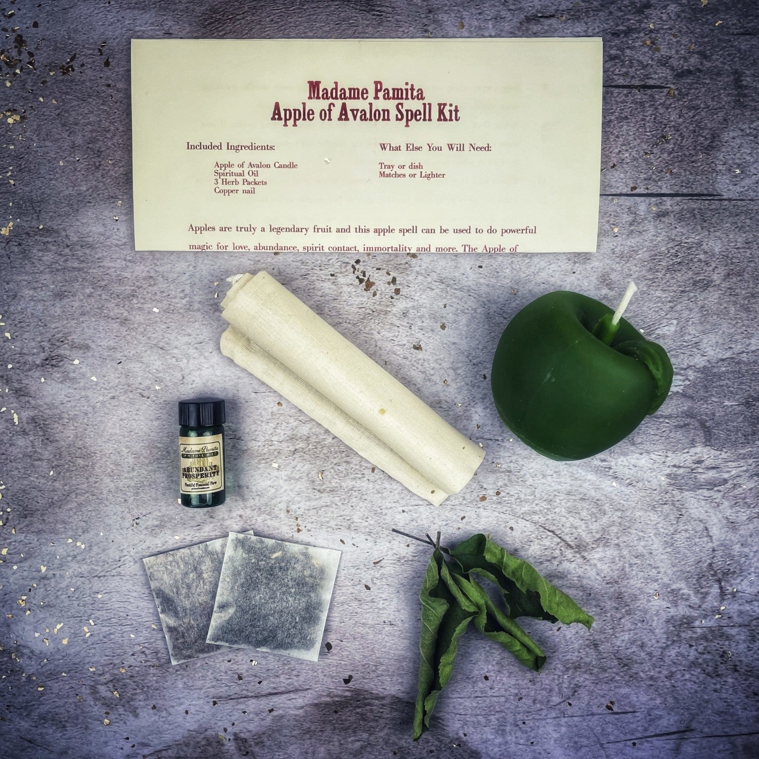Apple of Avalon Candle Spell Kit by Parlour of Wonders, featuring black candles and magical symbols for love and abundance spells.