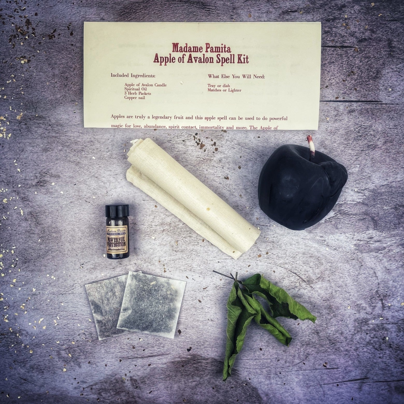 Parlour of Wonders Apple of Avalon Candle Spell Kit with black candle, herbs, and ingredients for love, abundance, and magic rituals.