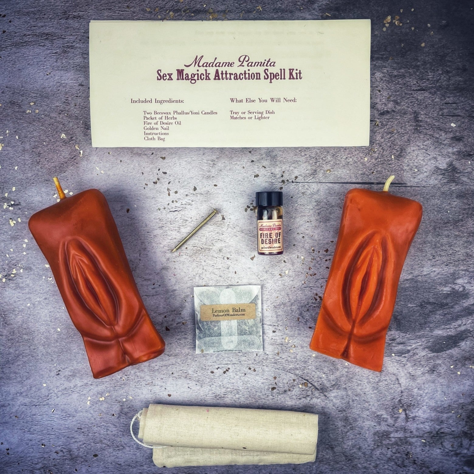 Black candle spell kit by Parlour of Wonders featuring yoni symbols for passion and desire magic.