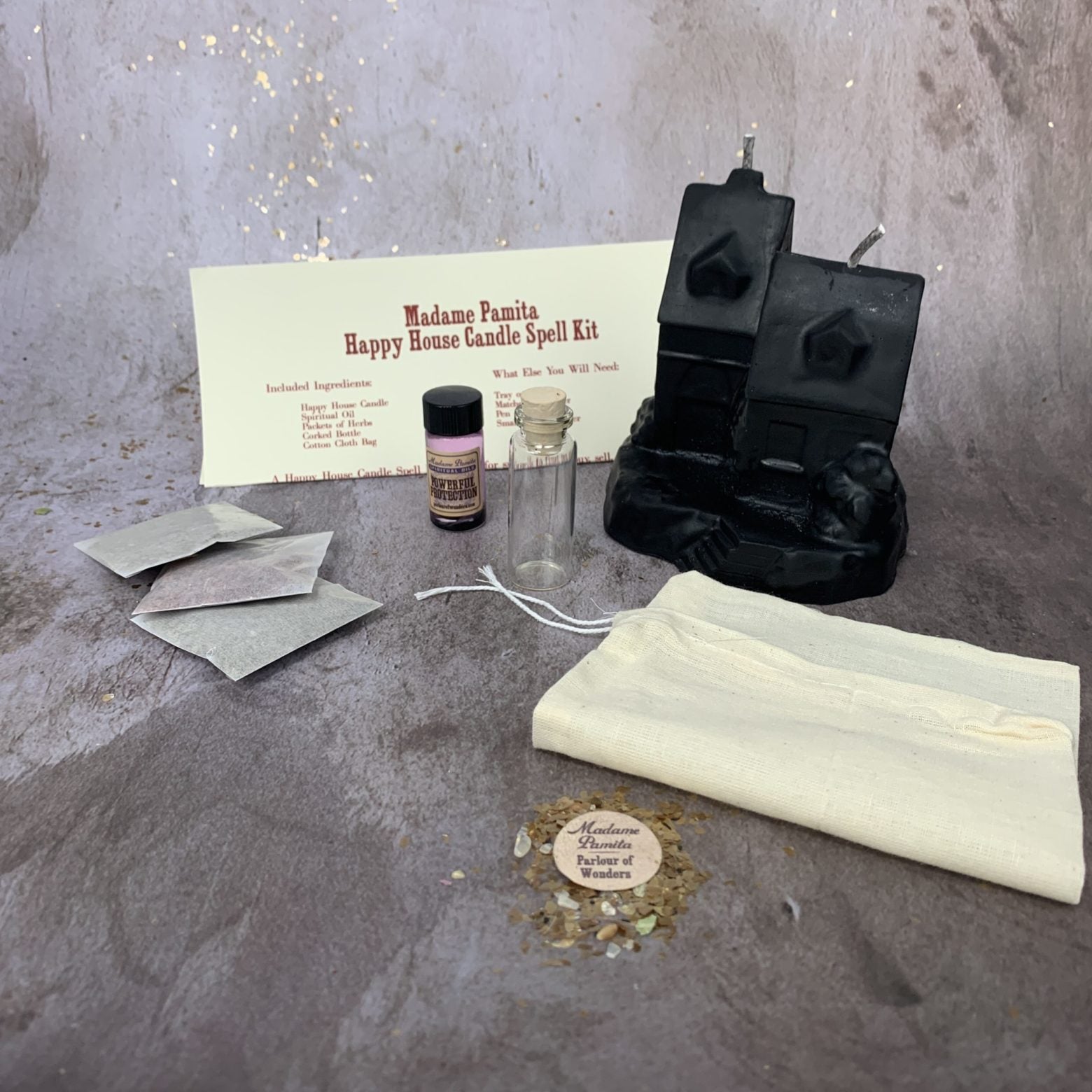 Parlour of Wonders Happy House Candle Spell Kit with black candles, herbs, and tools for home protection and harmony.