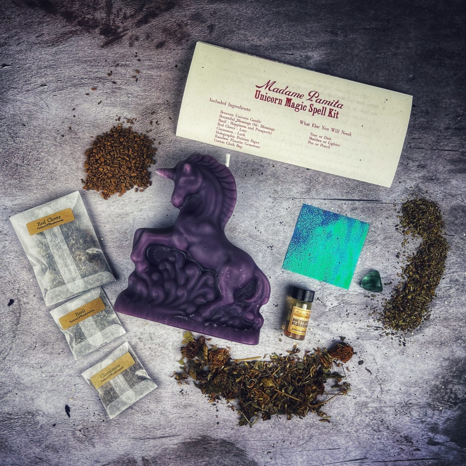 Parlour of Wonders Unicorn Magic Candle Spell Kit with black candles for manifestation and wishes, featuring mystical unicorn imagery.