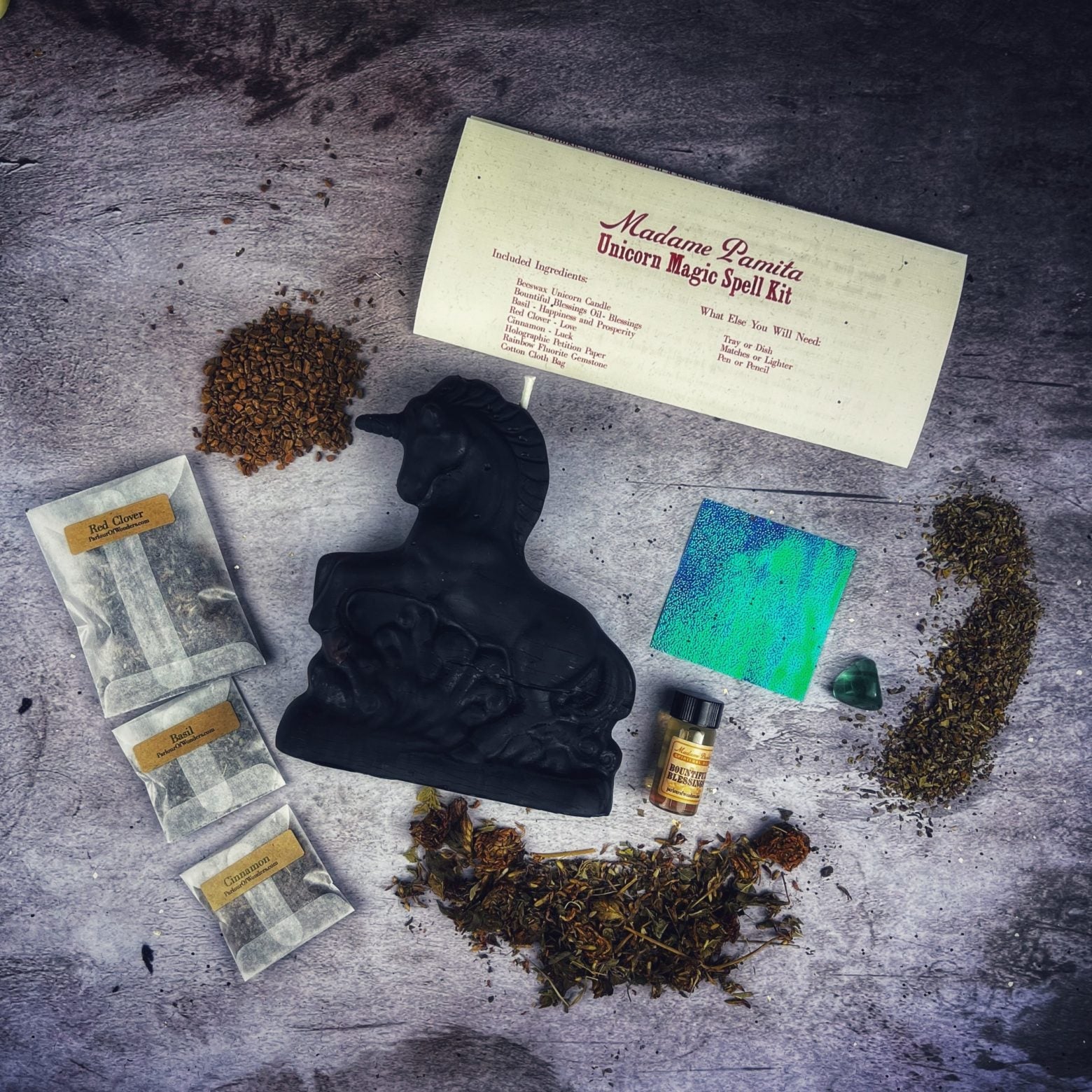 Black Unicorn Magic Candle Spell Kit by Parlour of Wonders, featuring candles and tools for manifestation and wish magic.