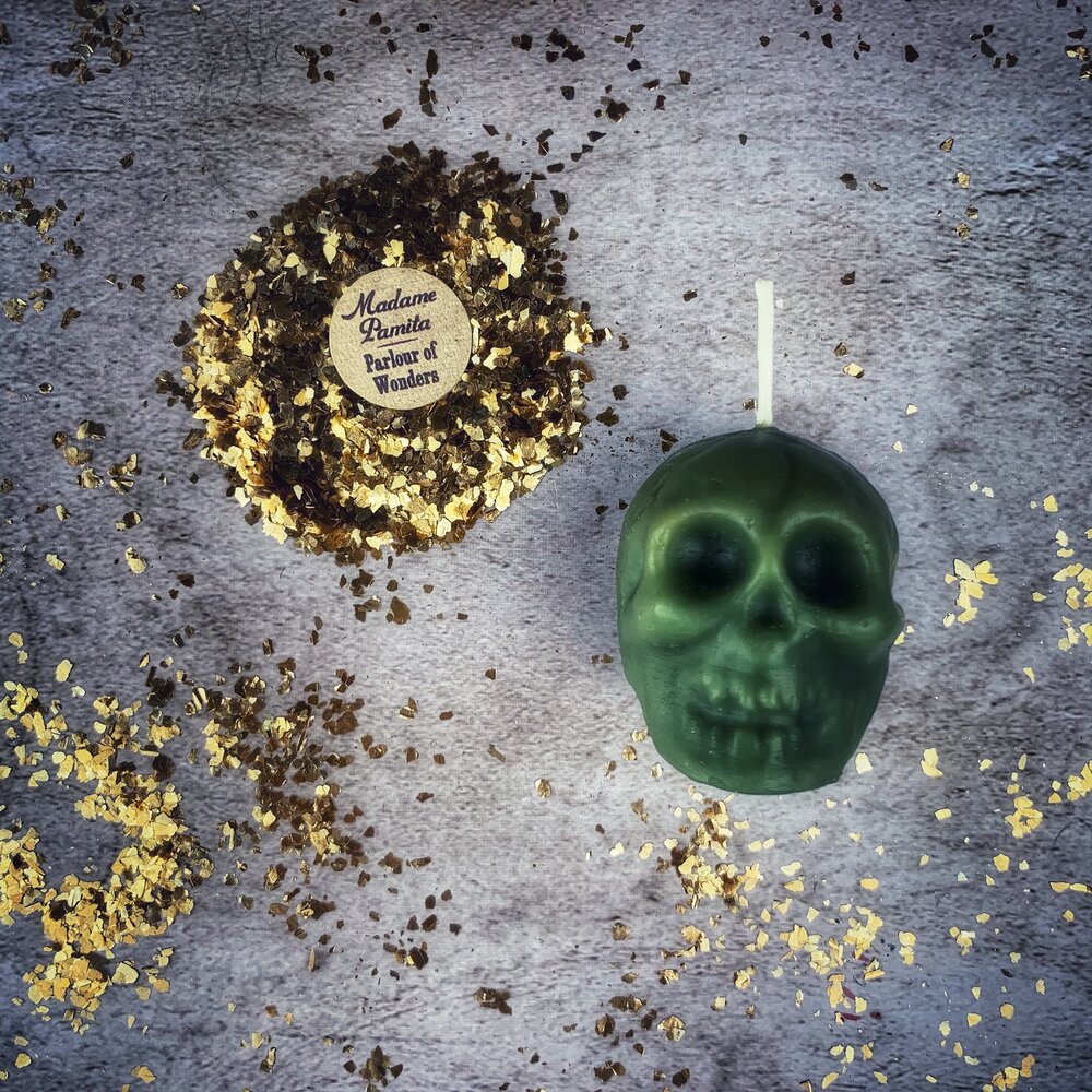Beeswax Skull Spell Candle from Parlour of Wonders with symbols for love, grounding, and ancestral wisdom magic.