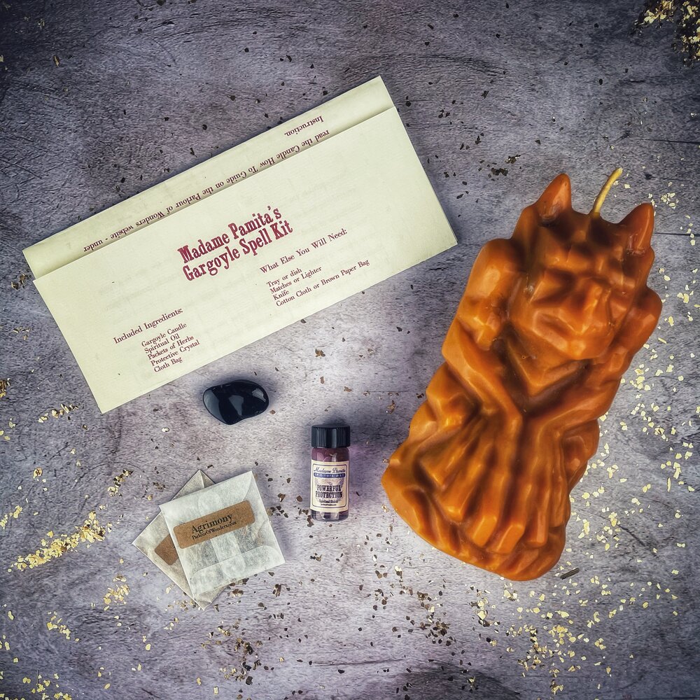 Parlour of Wonders Gargoyle Protection Candle Spell Kit with brown candles, featuring guardian magic for legal matters and protection.