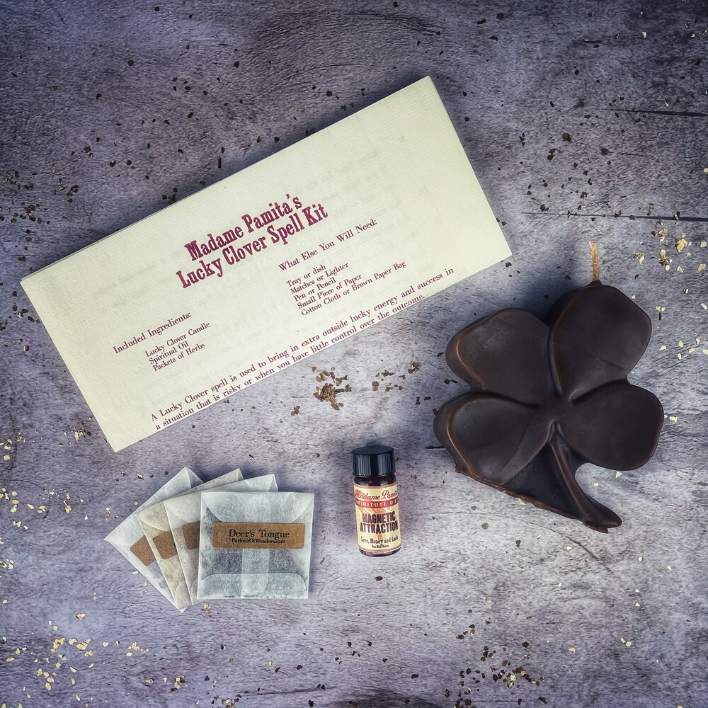 Green Candle Spell Kit with clover symbols from Parlour of Wonders for good fortune and luck spells.