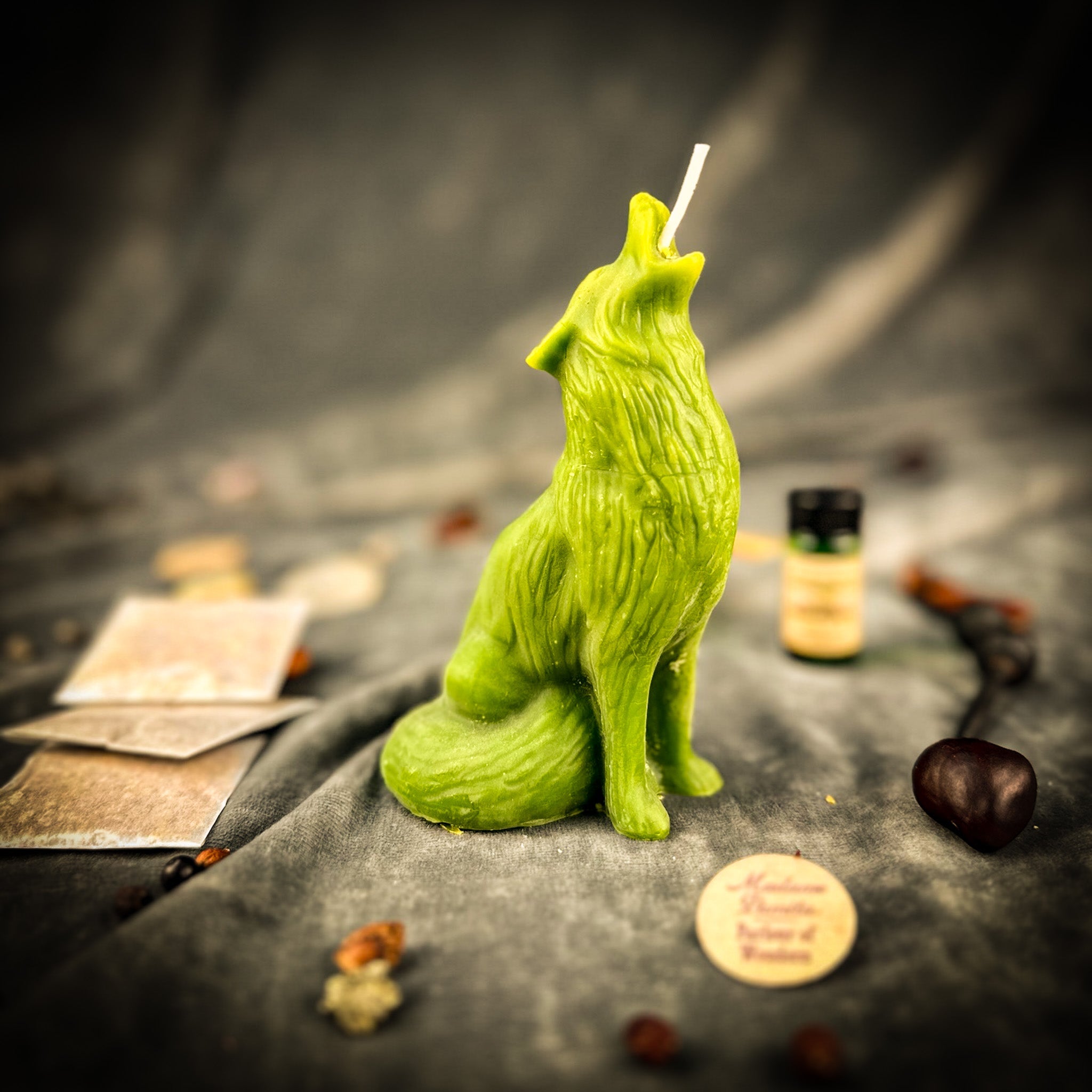 Green Howling Wolf Candle Spell Kit by Parlour of Wonders, featuring candles and tools for voice and courage magic.