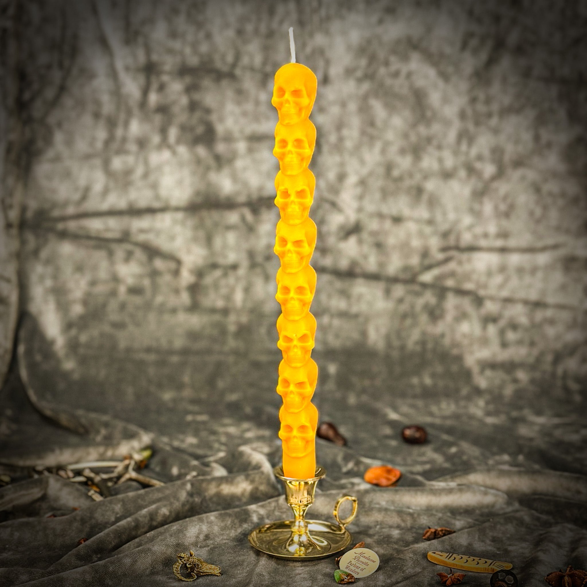 Orange Eight Day Skull Taper Candle Spell Kit by Parlour of Wonders for mind influence and ancestral wisdom.