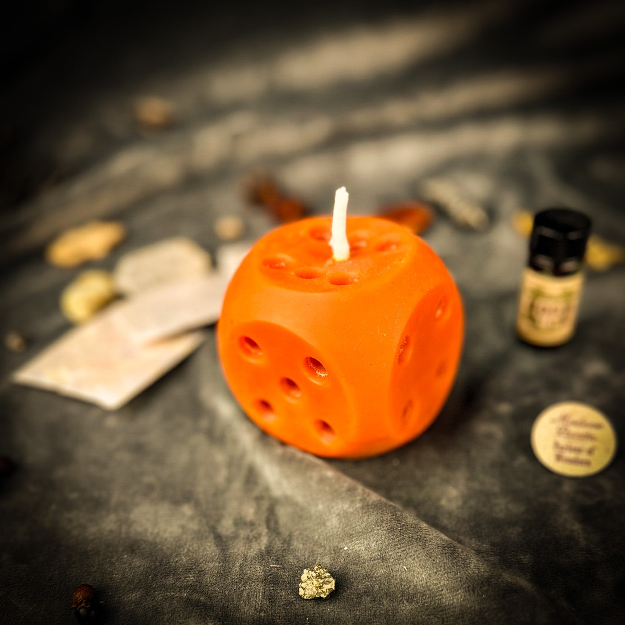 Lucky Dice Candle Spell Kit by Parlour of Wonders featuring orange candle, dice, and spell ingredients for gambling luck and good fortune.