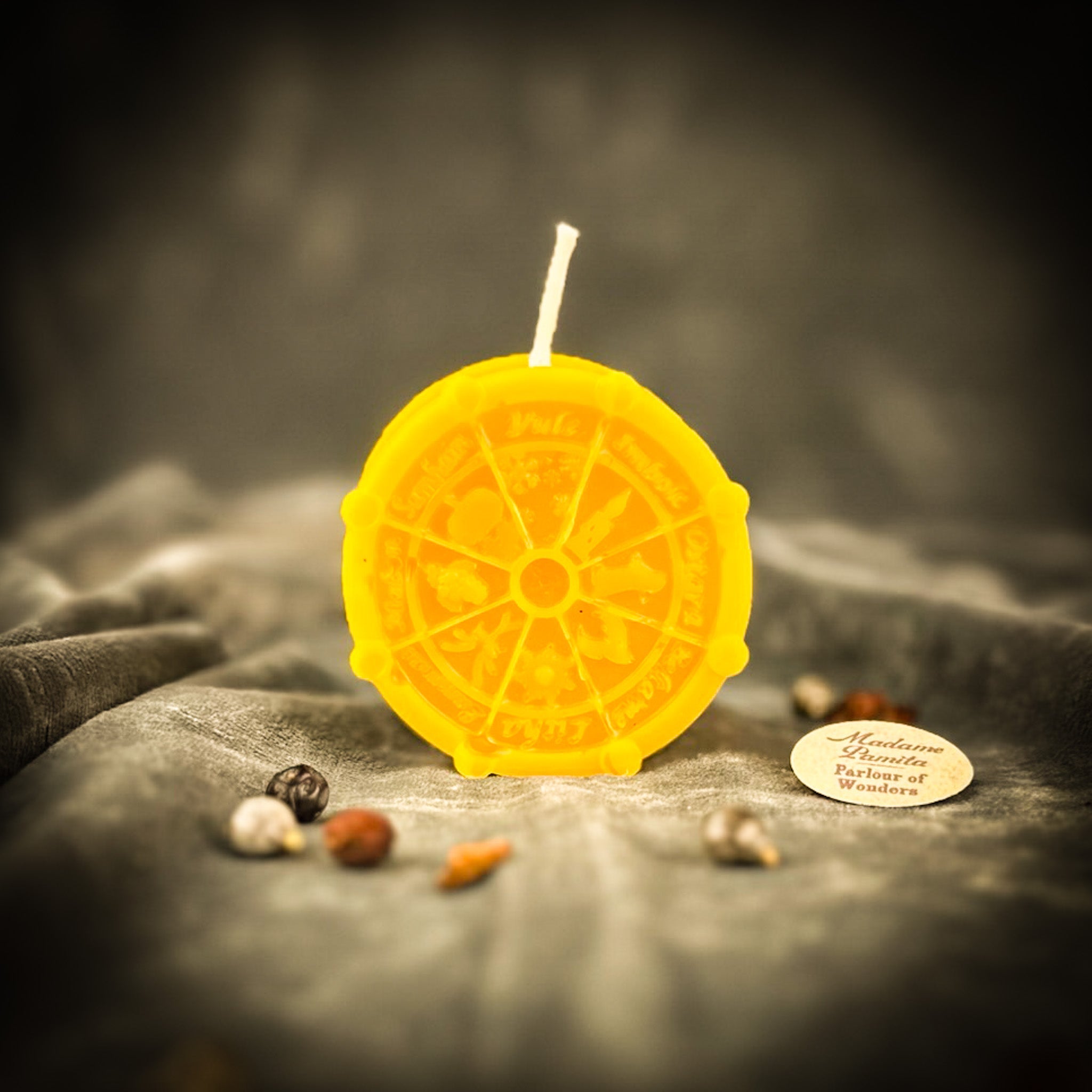 Orange Wheel of the Year Wishes Candle Spell Kit with seasonal symbols for Sabbat celebrations and seasonal magic by Parlour of Wonders.