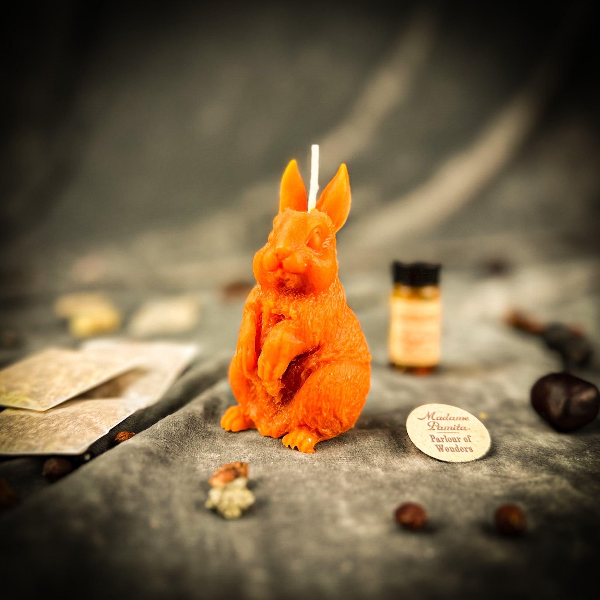 Parlour of Wonders Enchanted Bunny Candle Spell Kit for abundance and quick thinking magic, featuring orange candles and mystical symbols.
