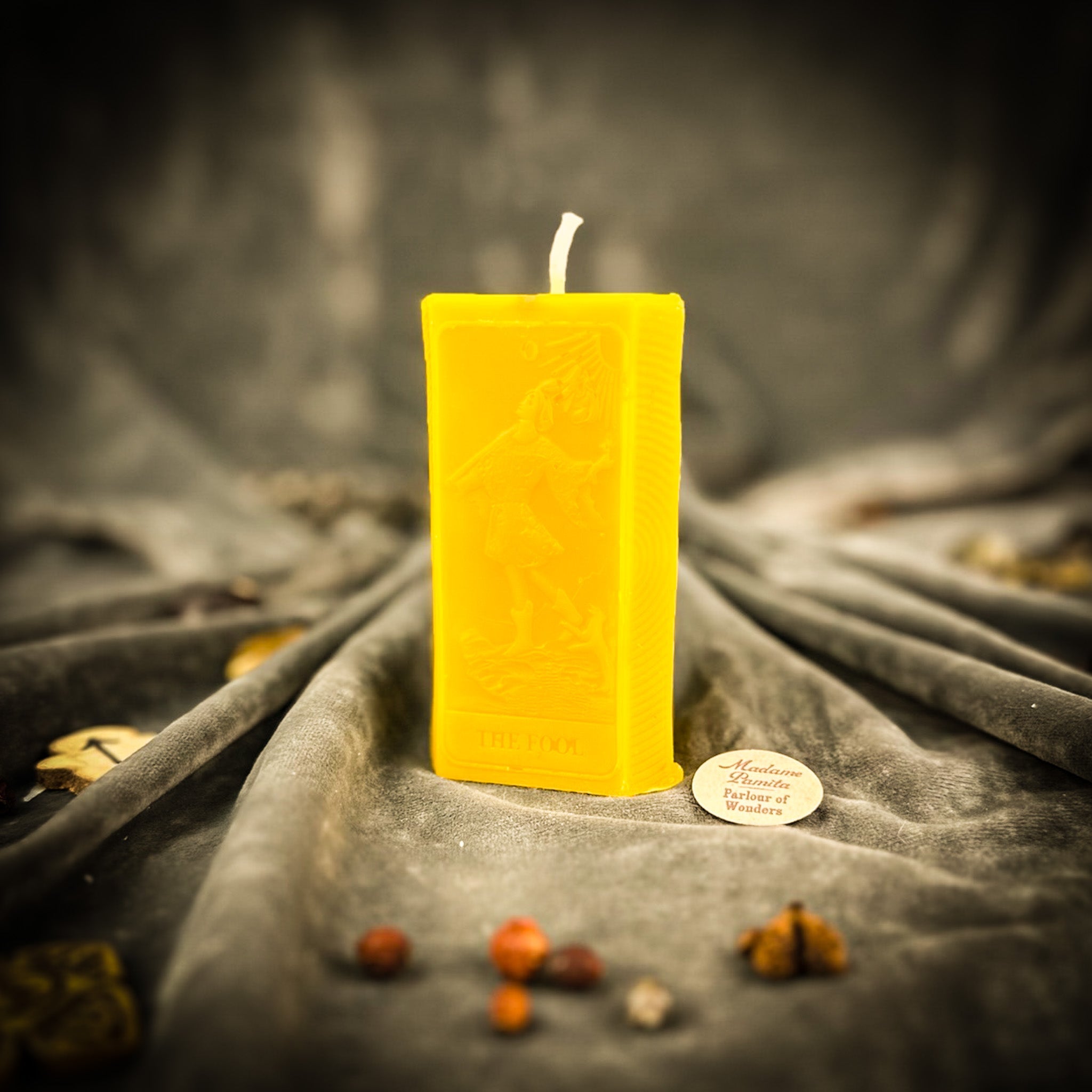 Parlour of Wonders Fool Candle Spell Kit with orange candle for new beginnings and adventure magic in a mystical packaging.