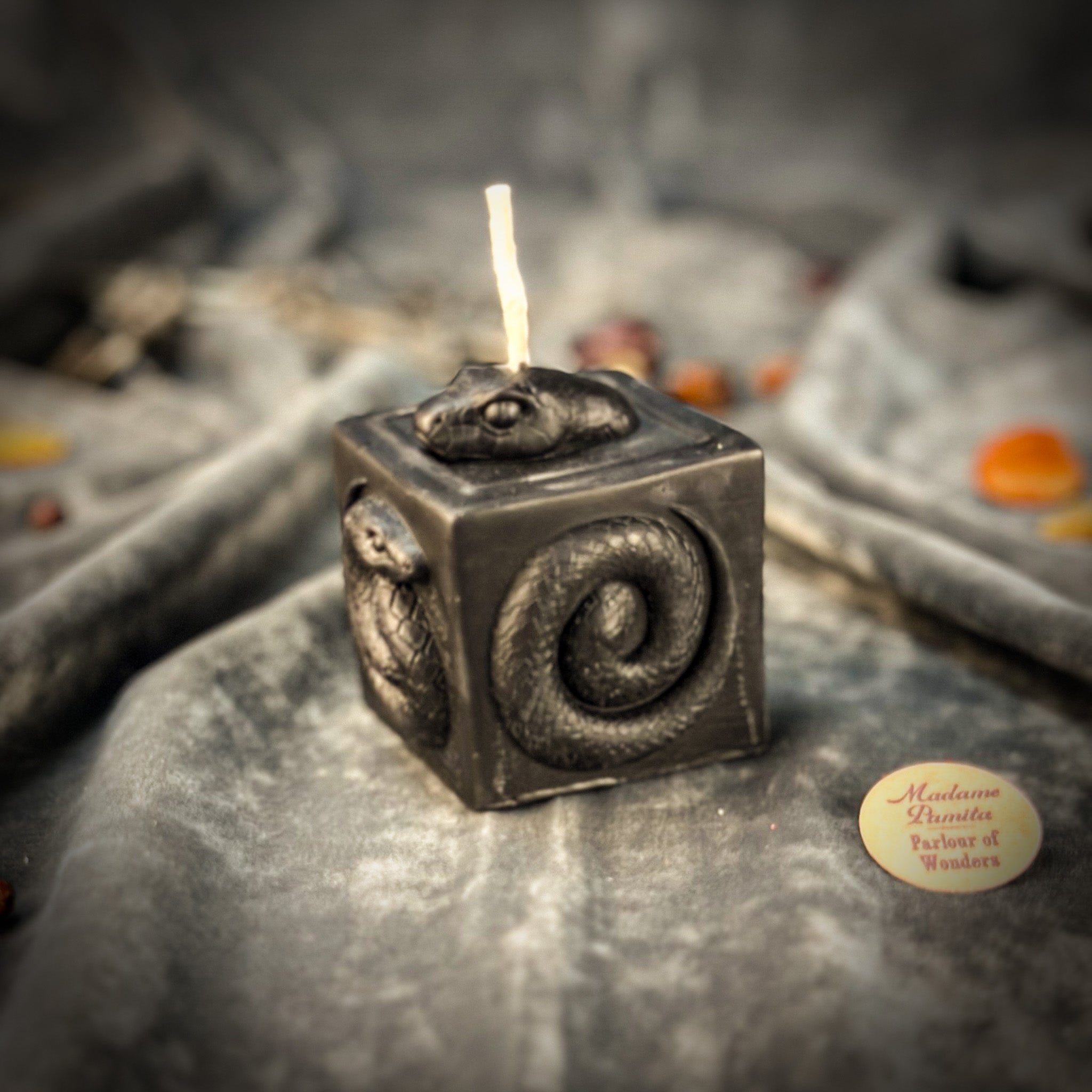 Parlour of Wonders Snake of Transformation Candle Spell Kit for renewal and personal growth, featuring pink candles and symbolic snake imagery.