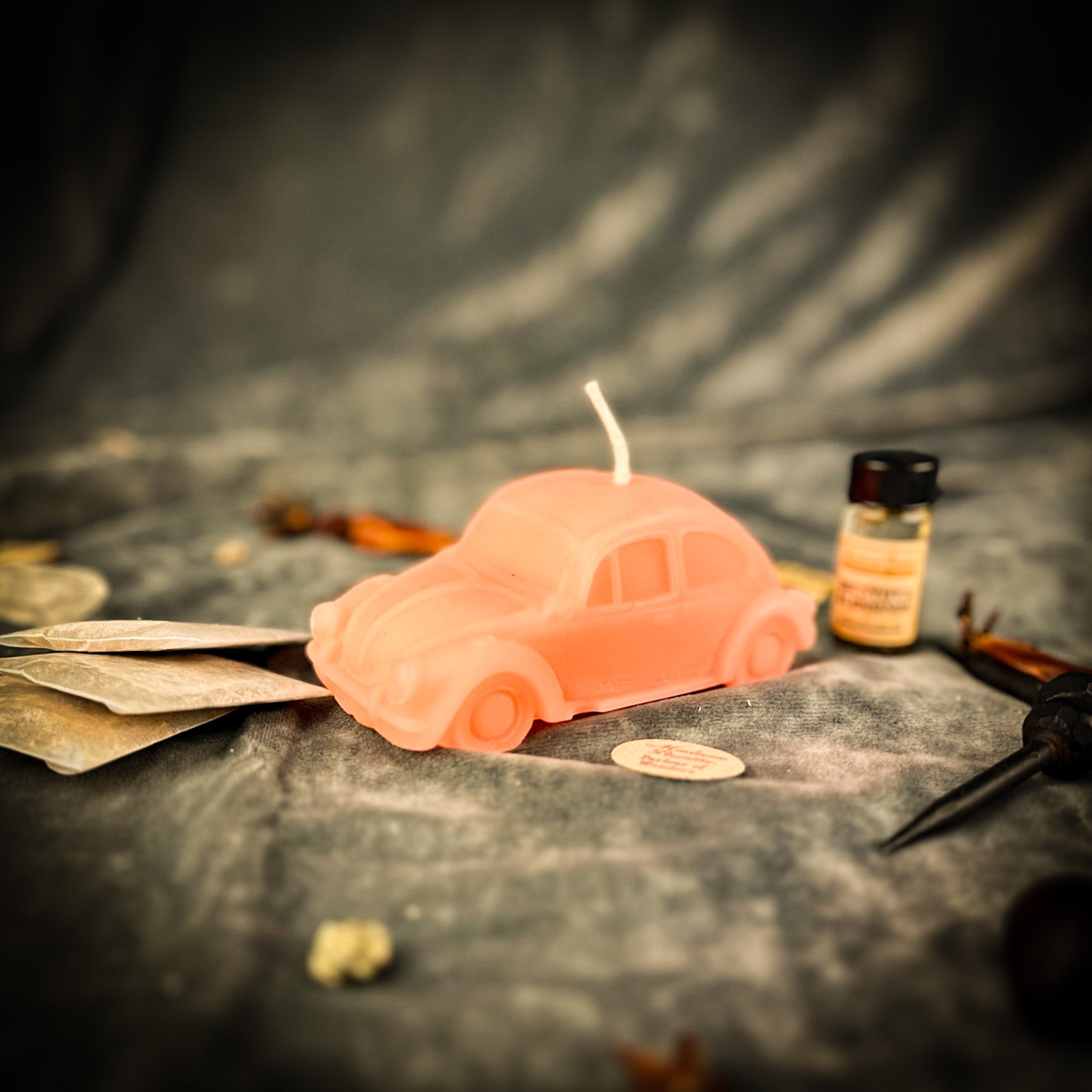 Parlour of Wonders Charmed Car Candle Spell Kit with pink candle for safe travels and successful shopping, featuring mystical symbols.