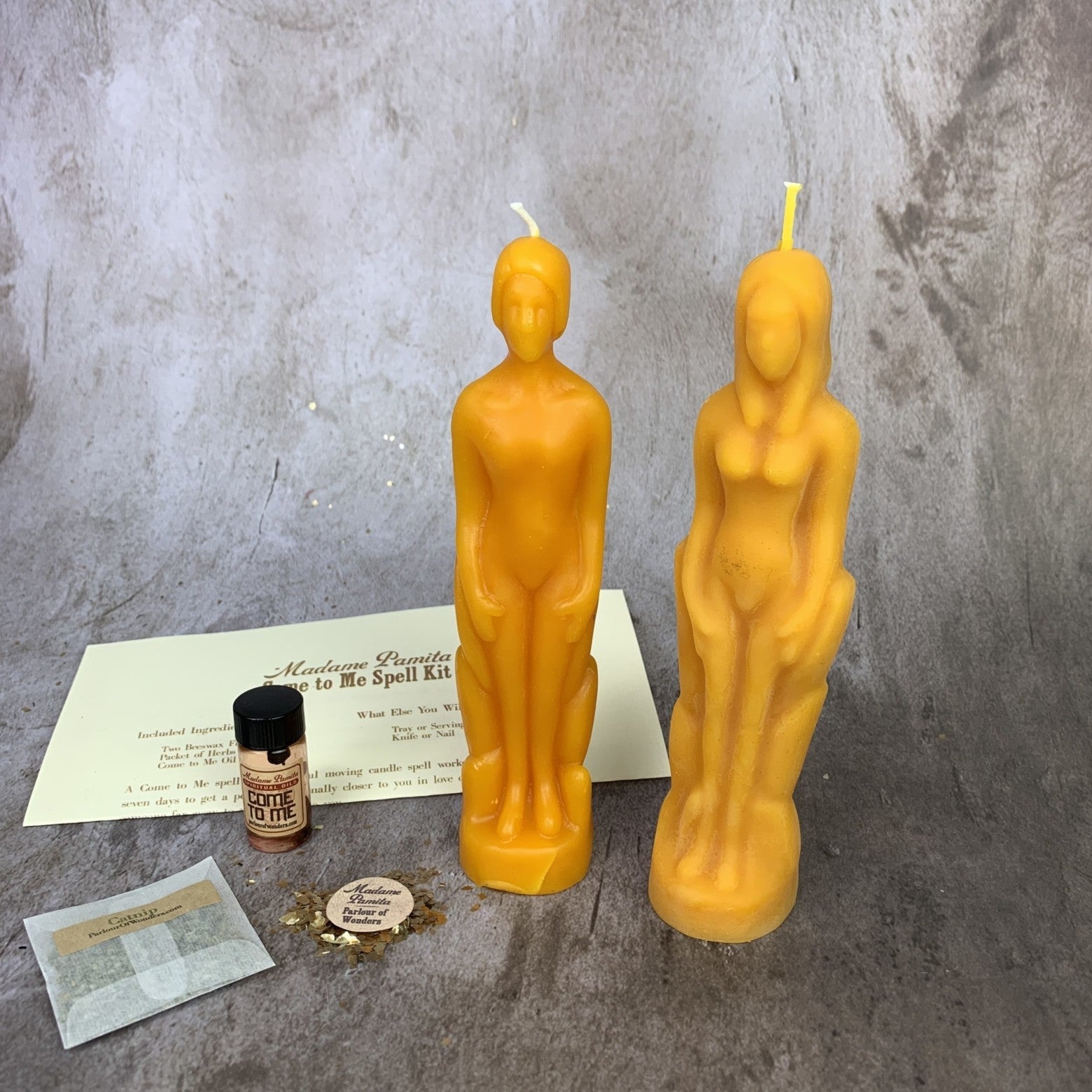 Come to Me Candle Spell Kit by Parlour of Wonders with purple candles and human female figure, designed to attract love and passion.