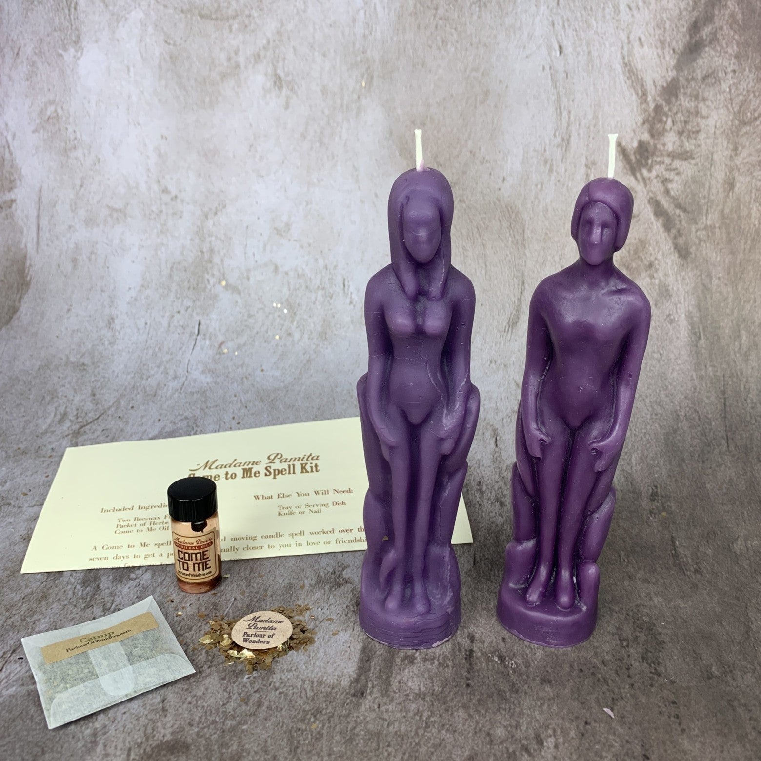 Parlour of Wonders Come to Me Candle Spell Kit with purple candles and human female figure, designed to attract love and passion.