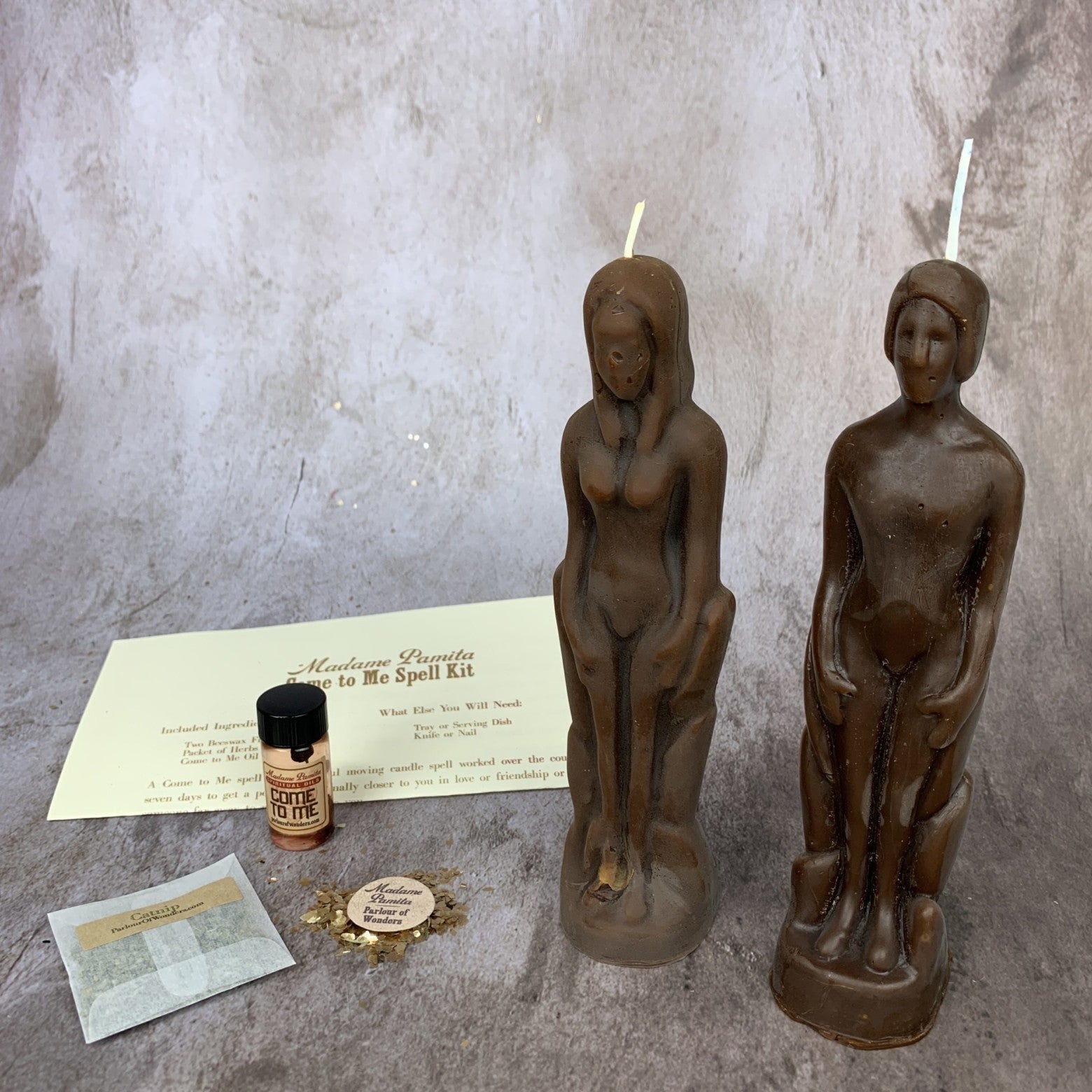 Parlour of Wonders Come to Me Candle Spell Kit with purple candles and human female figure, designed to attract love and passion.