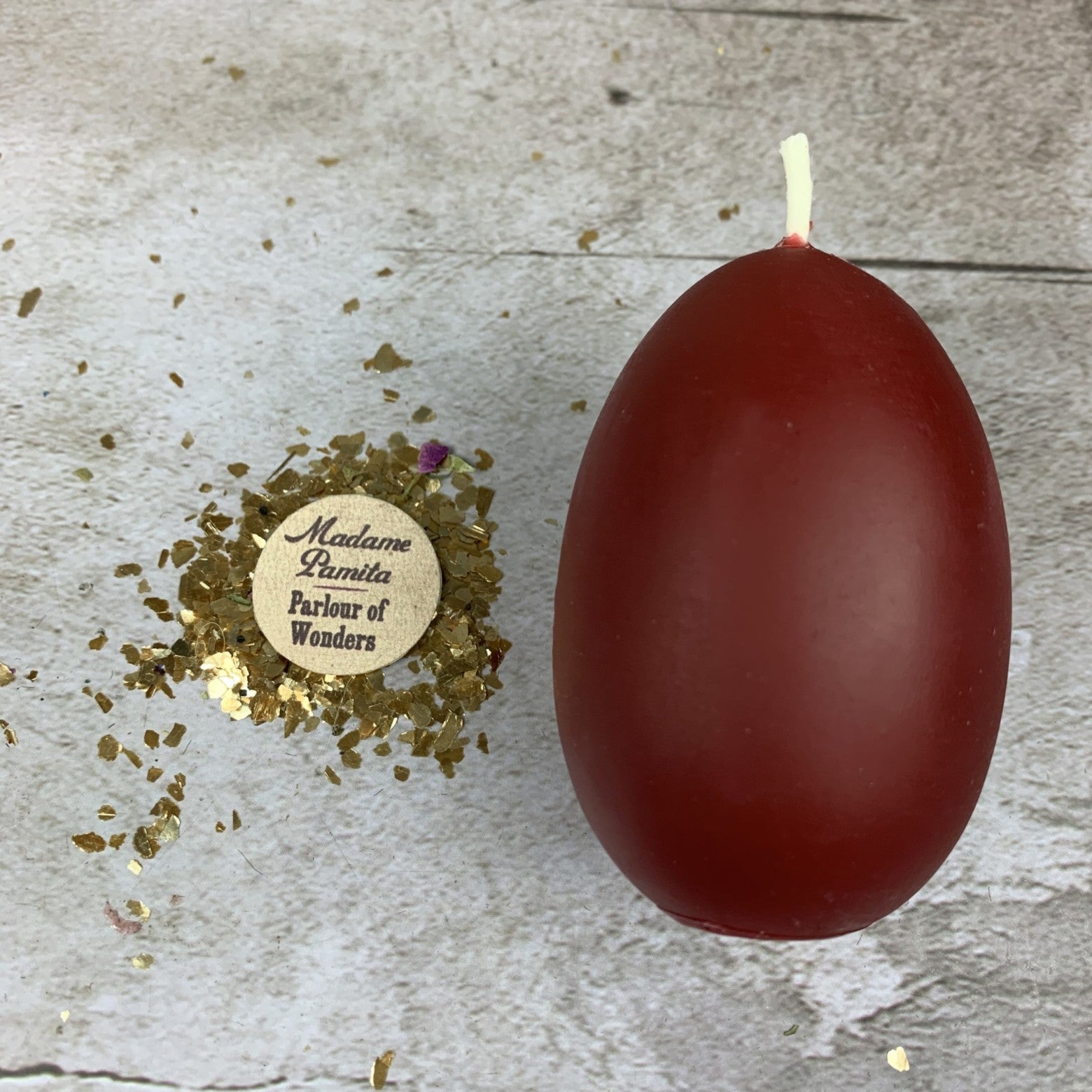 Purple Egg Talisman Candle Spell Kit for new beginnings and fertility magic, featuring candles, talisman, and ritual tools by Parlour of Wonders.