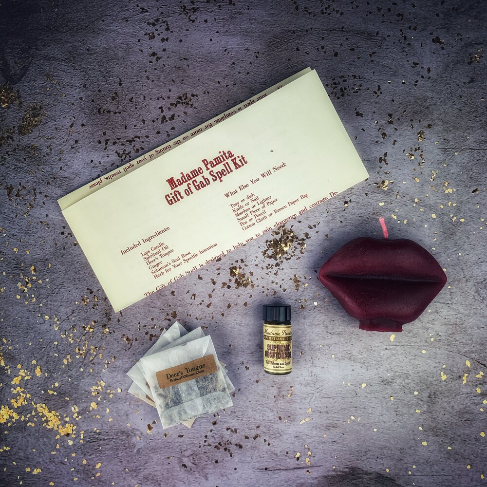 Parlour of Wonders Gift of Gab Candle Spell Kit with purple candles and spell components for eloquent speech and powerful communication.
