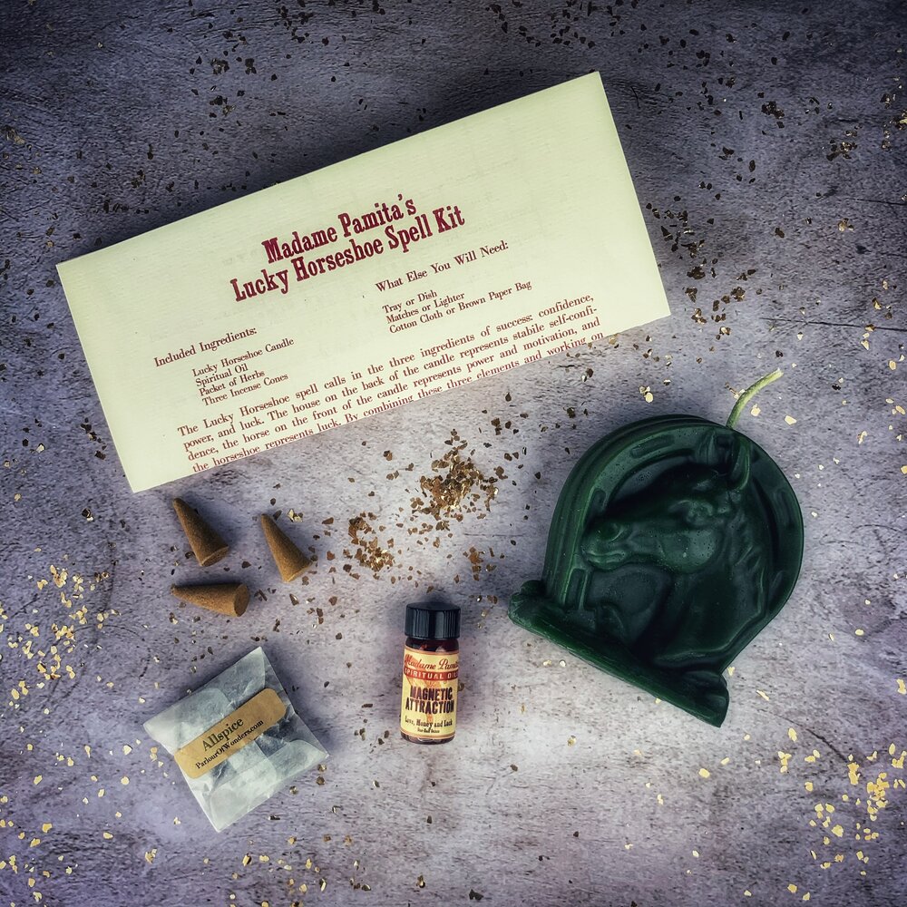Red Lucky Horseshoe Candle Spell Kit from Parlour of Wonders, includes candles and tools for luck and power magic rituals.