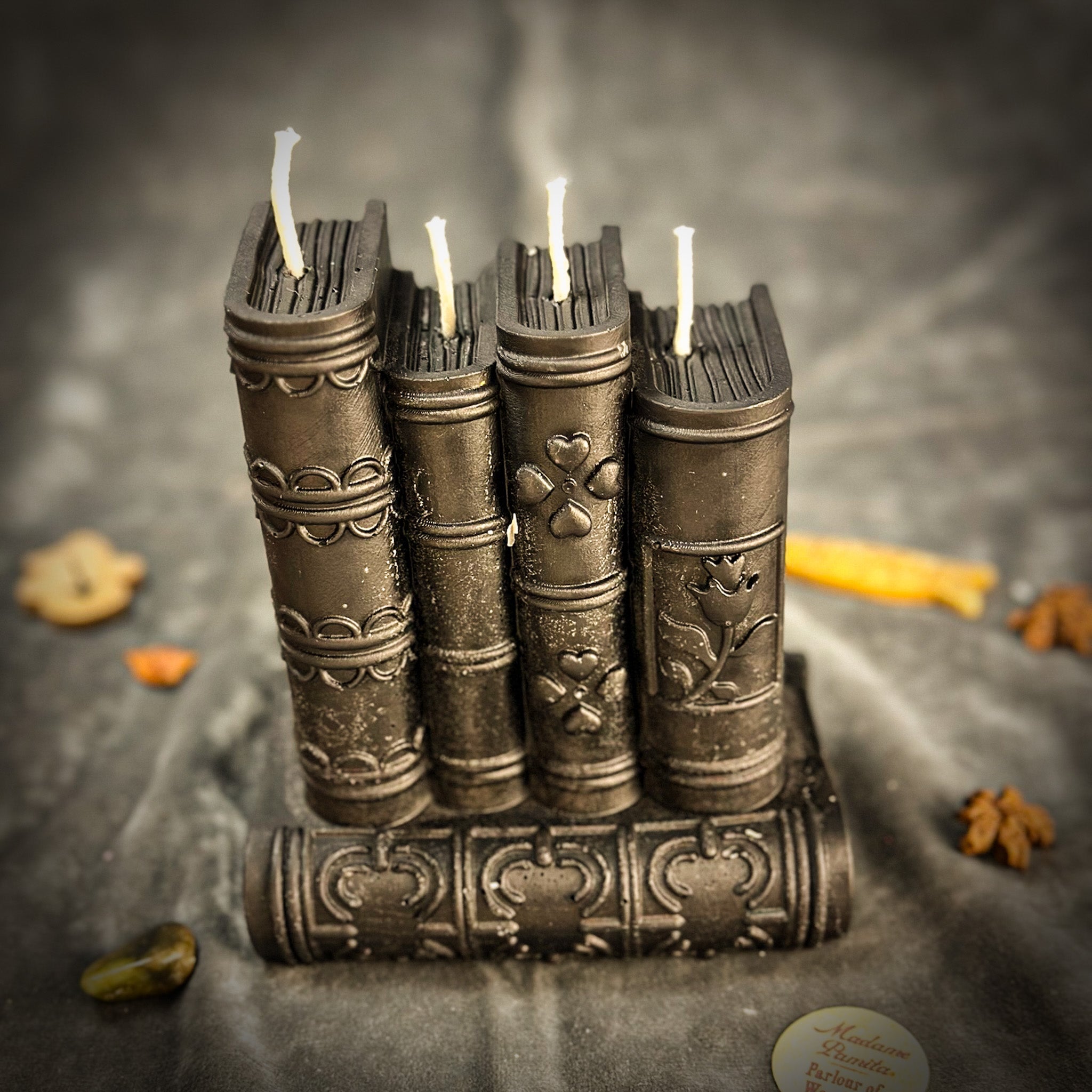 Red Candle Spell Kit from Parlour of Wonders with magic books for learning, writing, and creativity, featuring candles and spell tools.