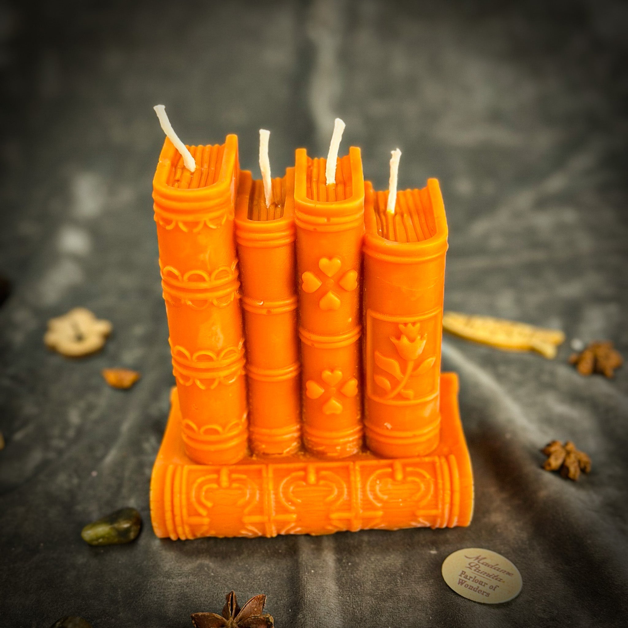 Red Books of Magic Candle Spell Kit by Parlour of Wonders with candles, spell ingredients, and writing tools for creativity and learning.