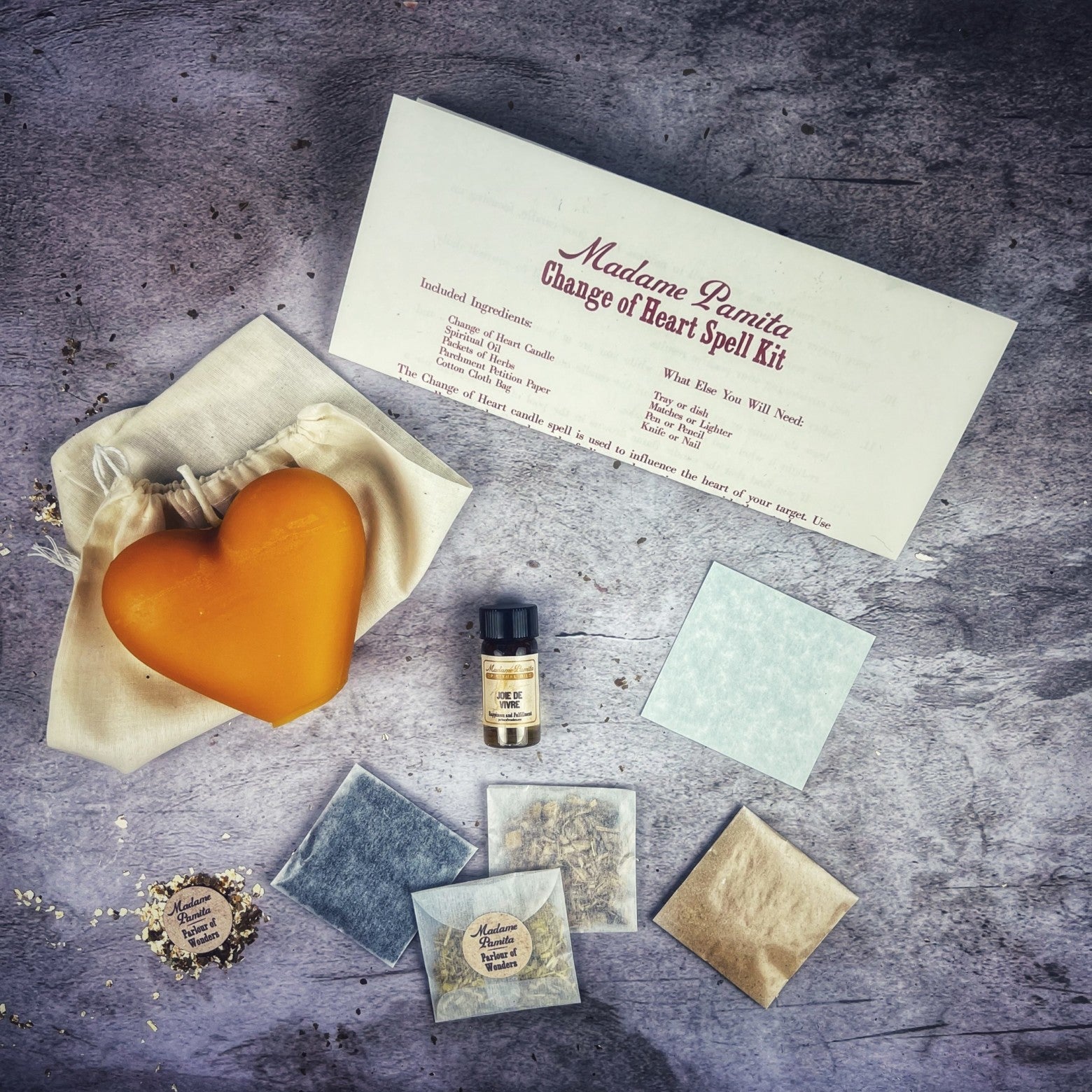 Red Candle Spell Kit for love reconciliation and emotional healing by Parlour of Wonders, includes candles and spell components.