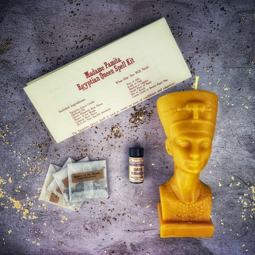 Egyptian Queen Candle Spell Kit by Parlour of Wonders, featuring red candle and magical tools for power, beauty, and magnetism spells.