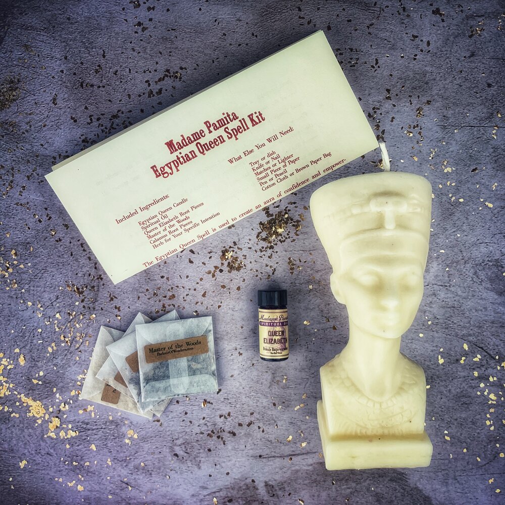 Egyptian Queen Candle Spell Kit by Parlour of Wonders with red candles, symbols of power, beauty, and magnetism magic.