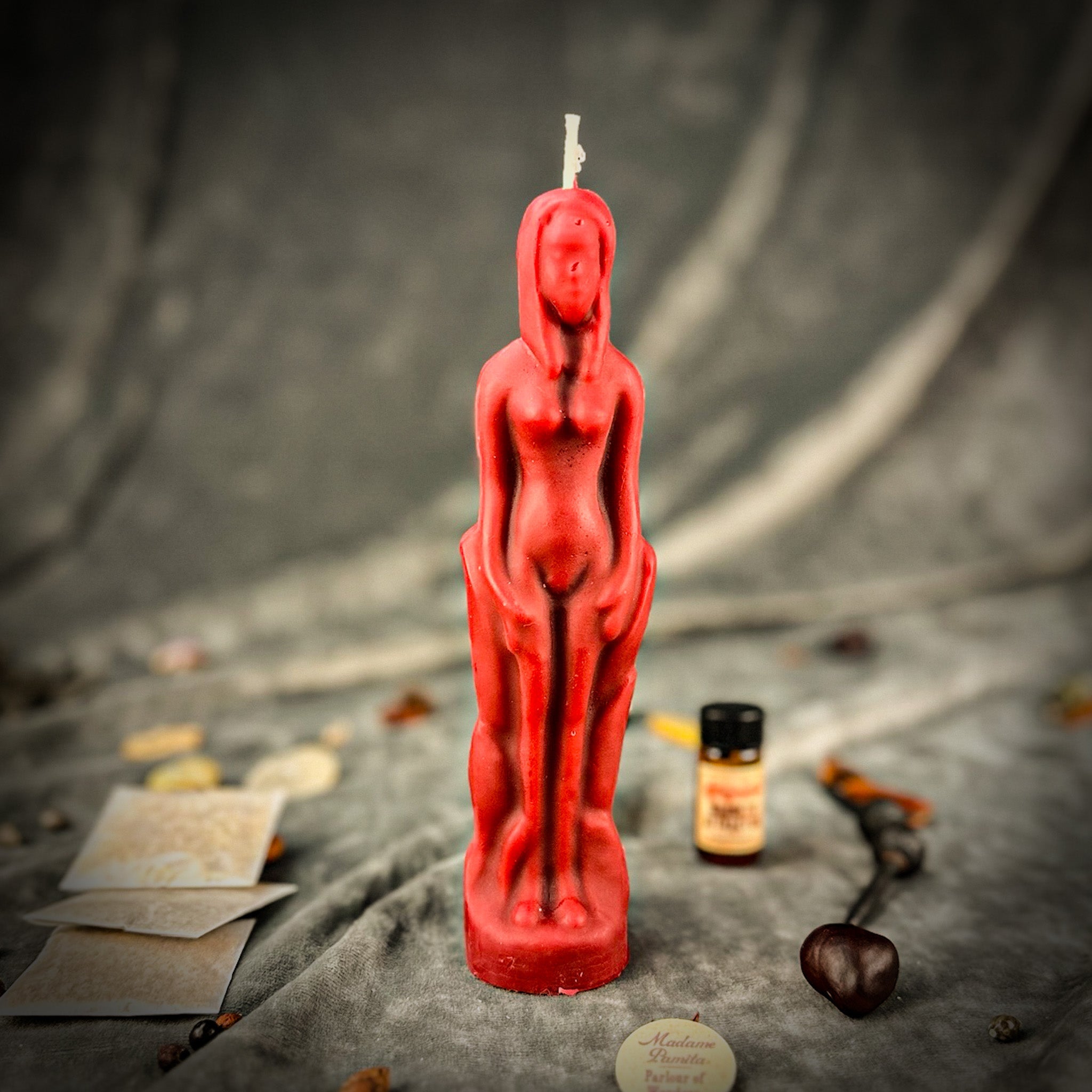 Red female figural candle from Parlour of Wonders Candle Spell Kit for sympathetic magic and personal power rituals.
